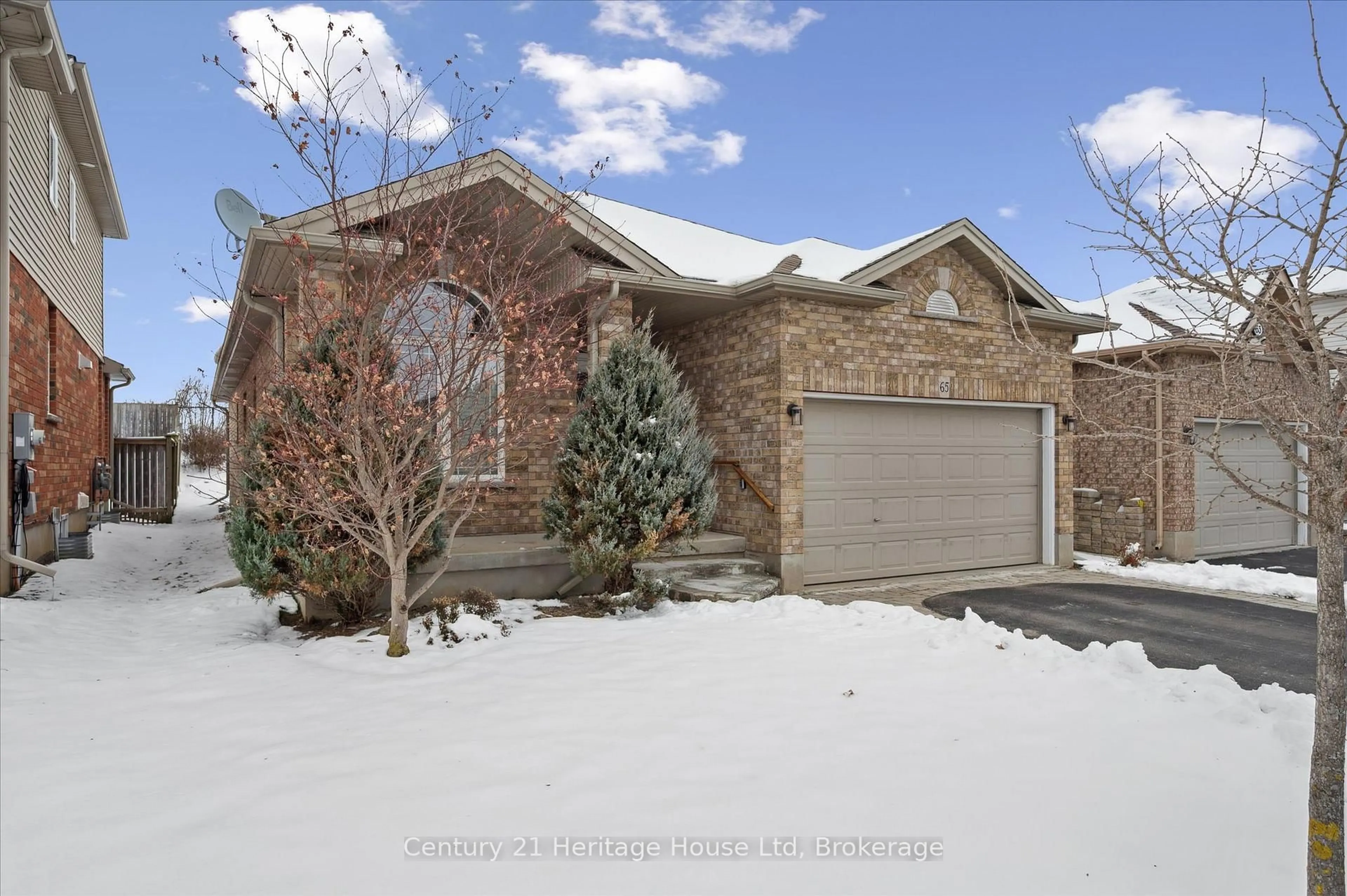 Home with brick exterior material, street for 65 Norton Dr, Guelph Ontario N1E 7K8