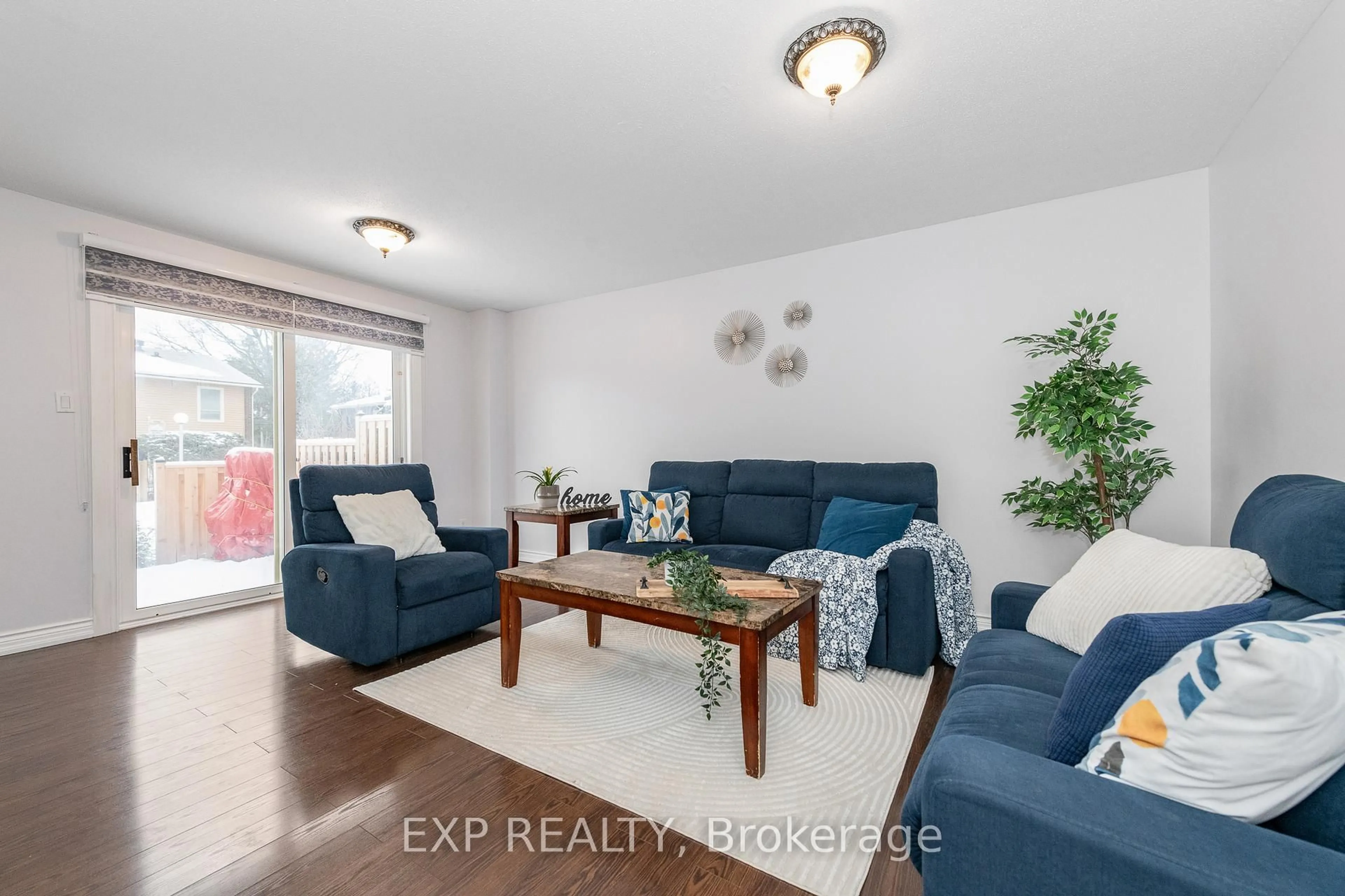 Living room with furniture, wood/laminate floor for 6 Arnold Dr #F, Ottawa Ontario K2H 6V9
