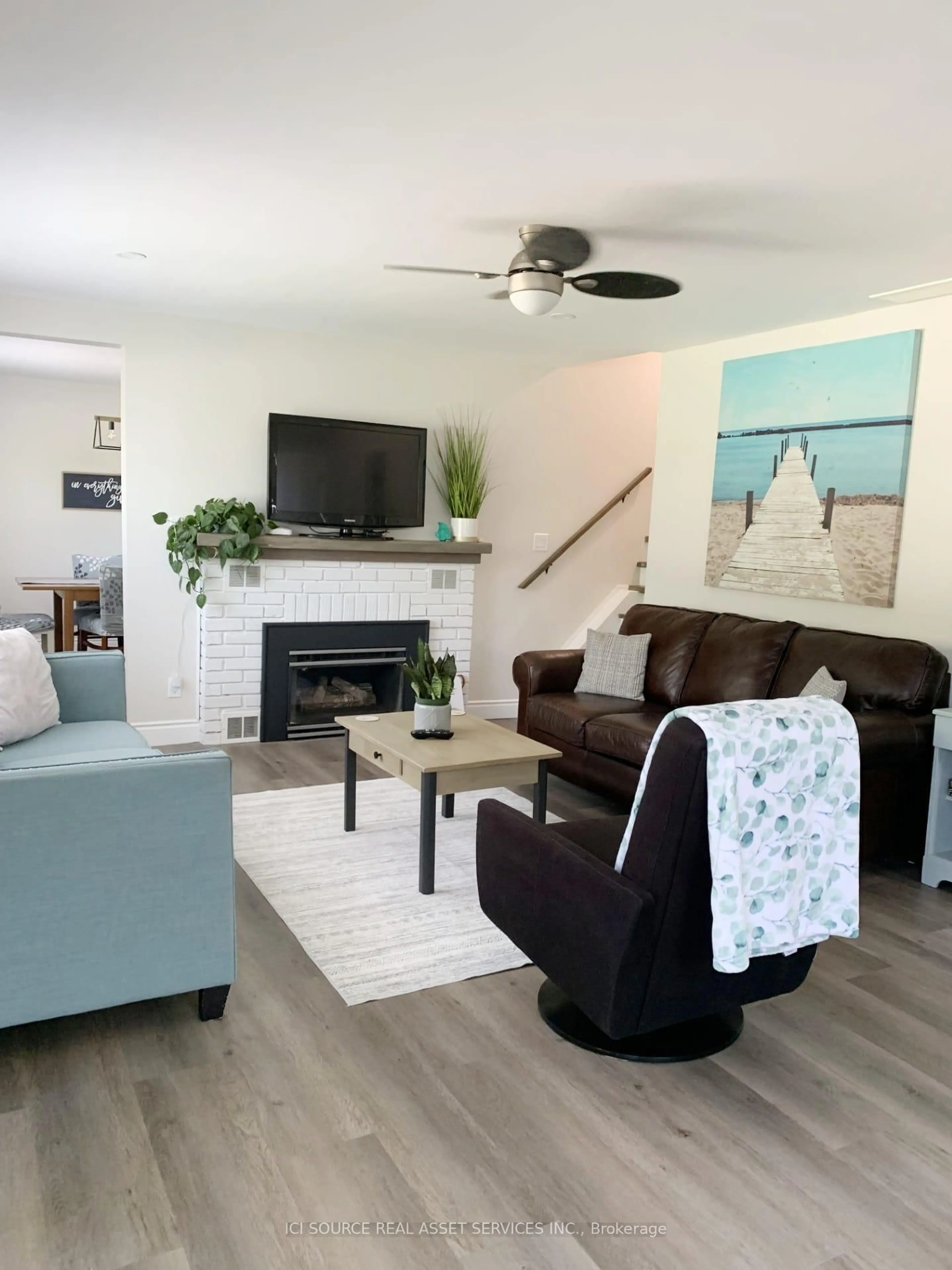 Living room with furniture, wood/laminate floor for 262 Green St, Saugeen Shores Ontario N0H 2C0