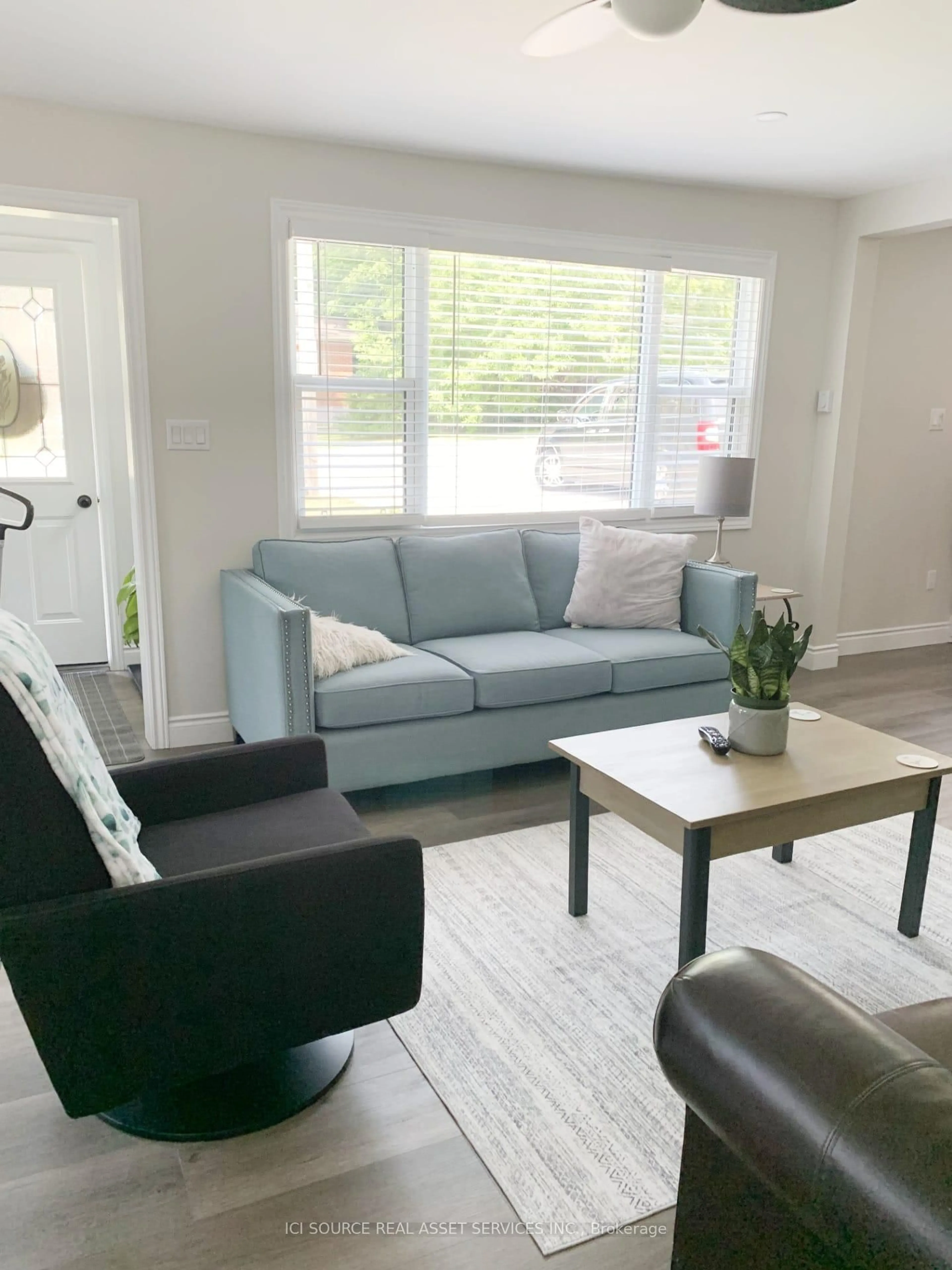 Living room with furniture, wood/laminate floor for 262 Green St, Saugeen Shores Ontario N0H 2C0