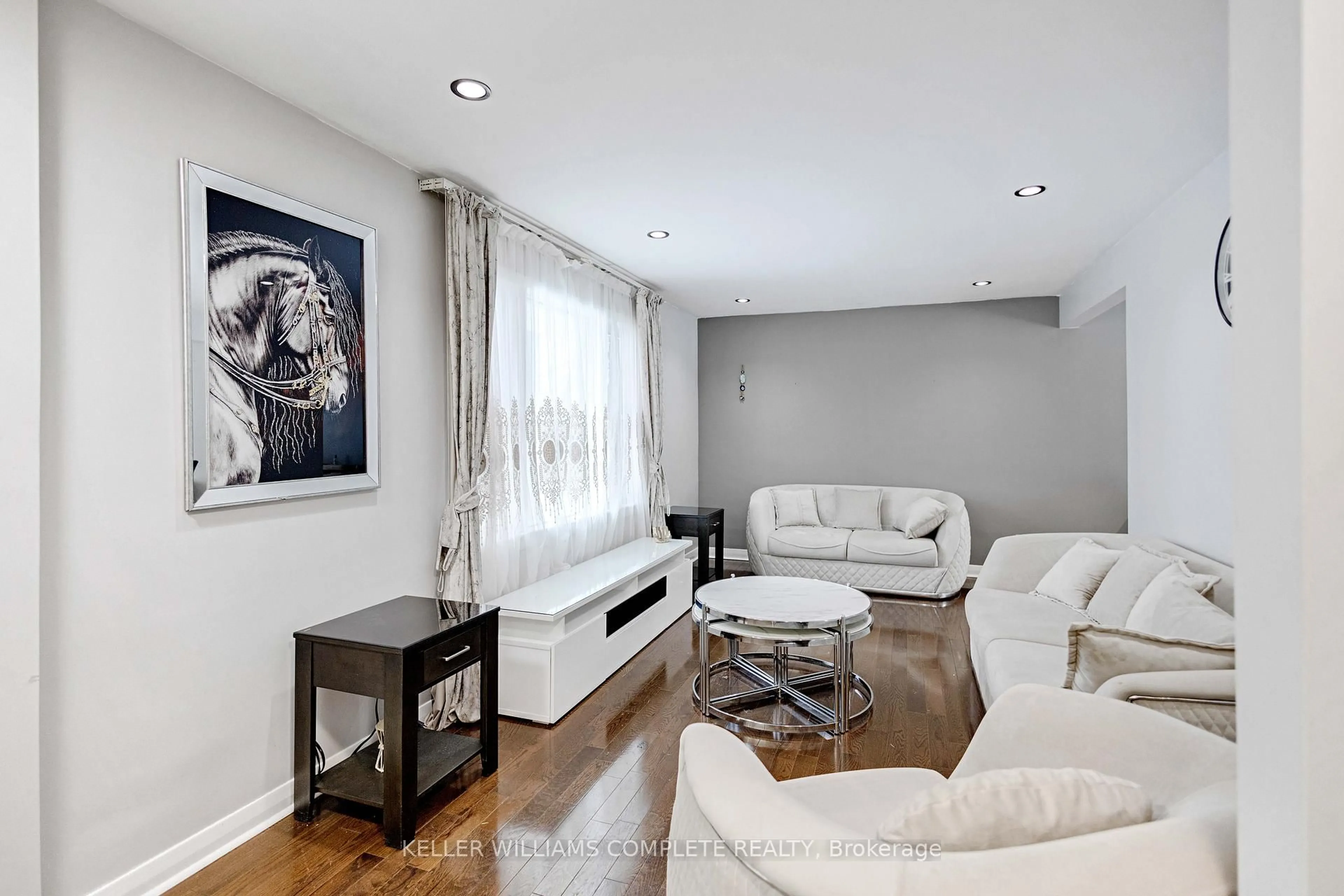 Living room with furniture, wood/laminate floor for 64 EVELYN St, Brantford Ontario N3R 3H1