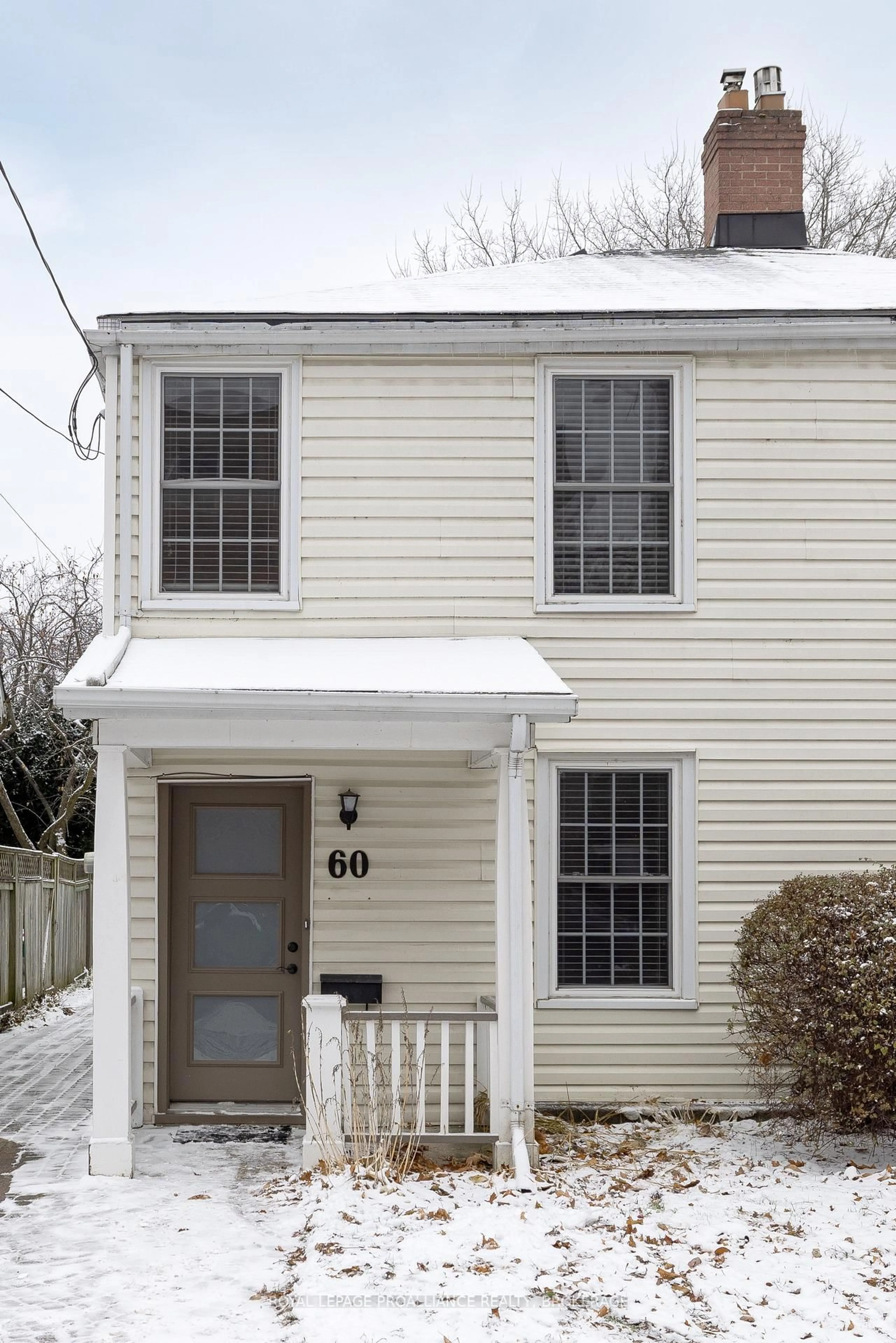 Home with vinyl exterior material, street for 60 Colborne St, Kingston Ontario K7K 1C6