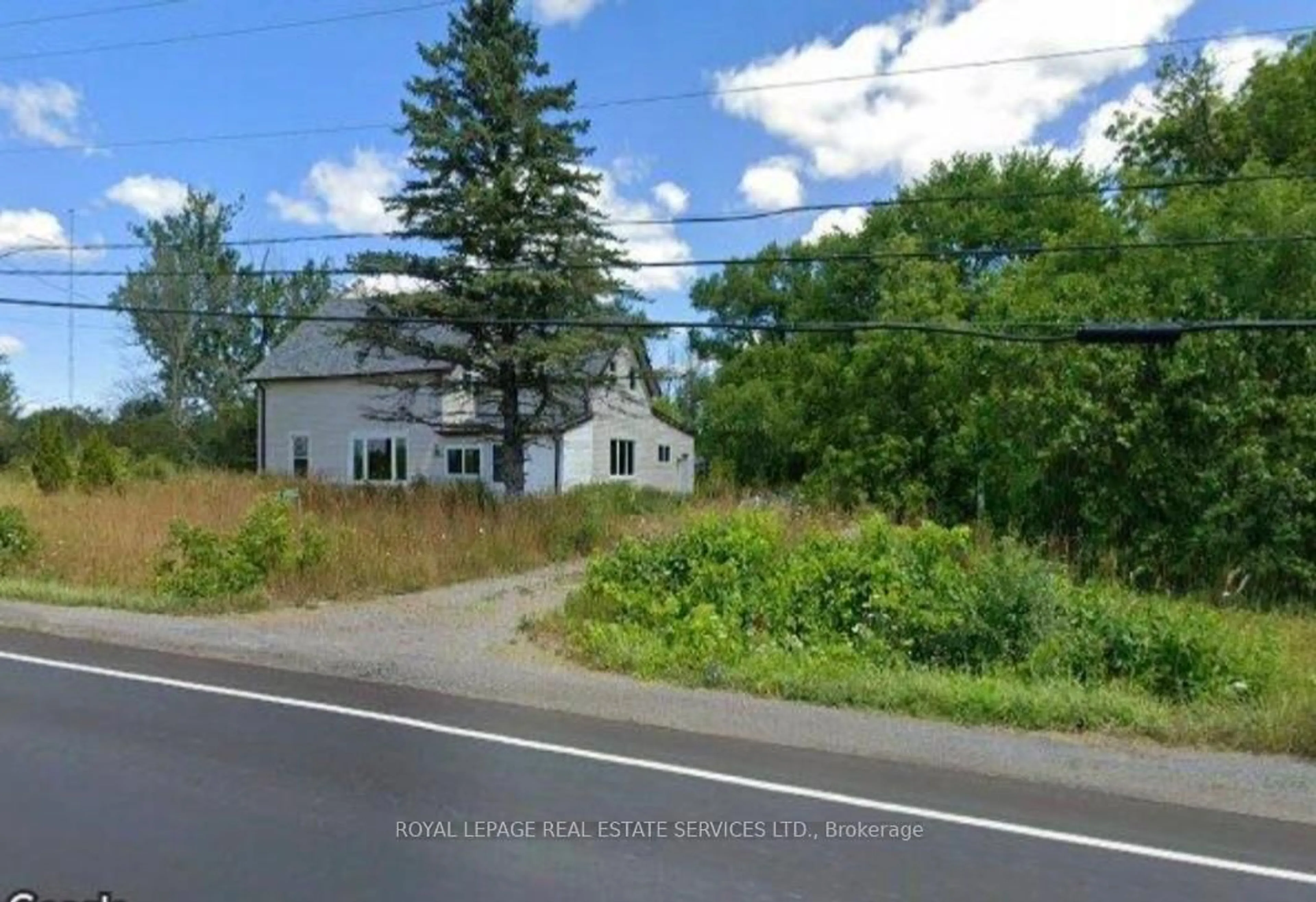 A pic from outside/outdoor area/front of a property/back of a property/a pic from drone, street for 21062 Loyalist Pkwy, Prince Edward County Ontario K0K 1L0