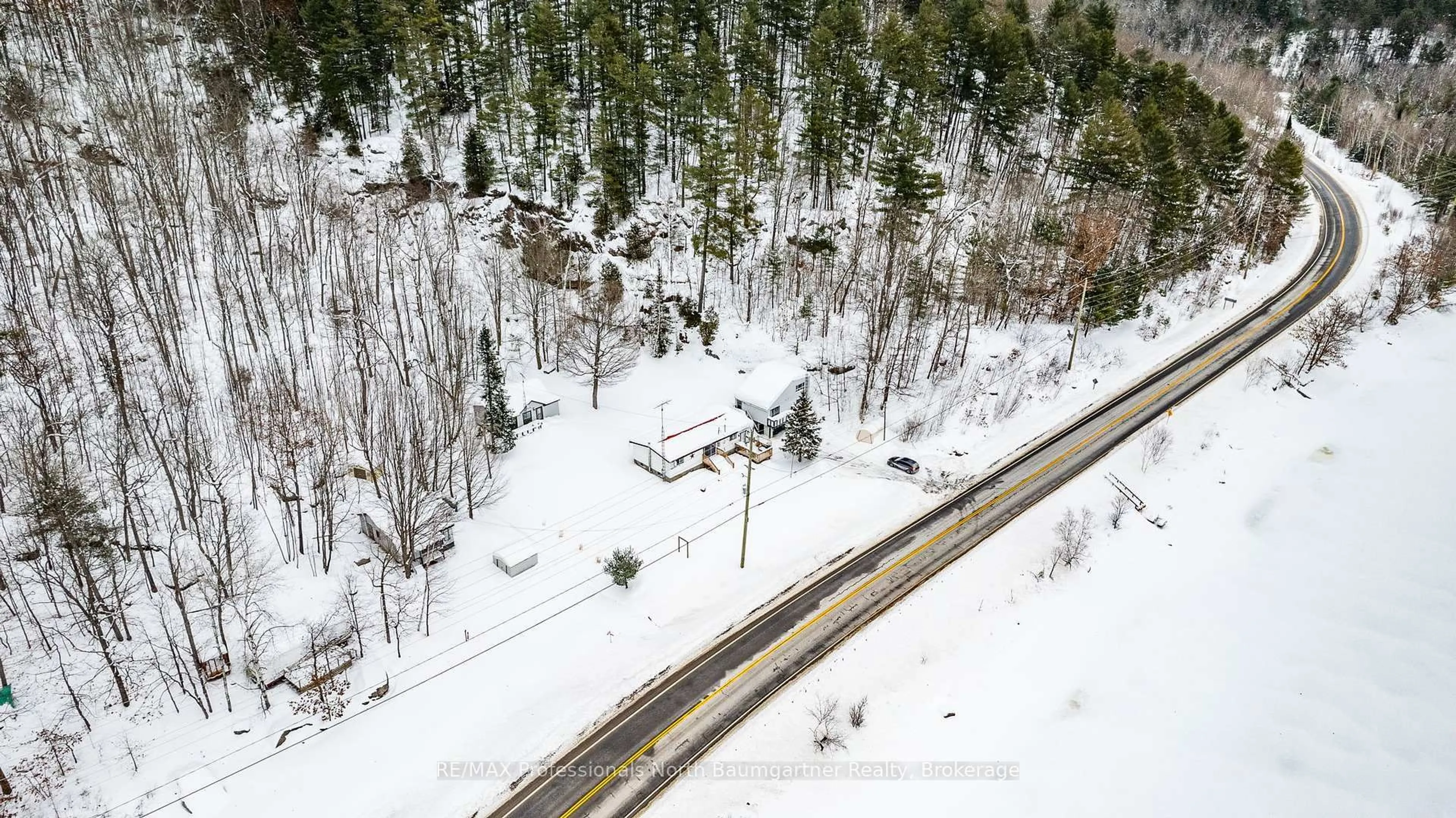 A pic from outside/outdoor area/front of a property/back of a property/a pic from drone, unknown for 18830 Hwy 35, Algonquin Highlands Ontario K0M 1J2