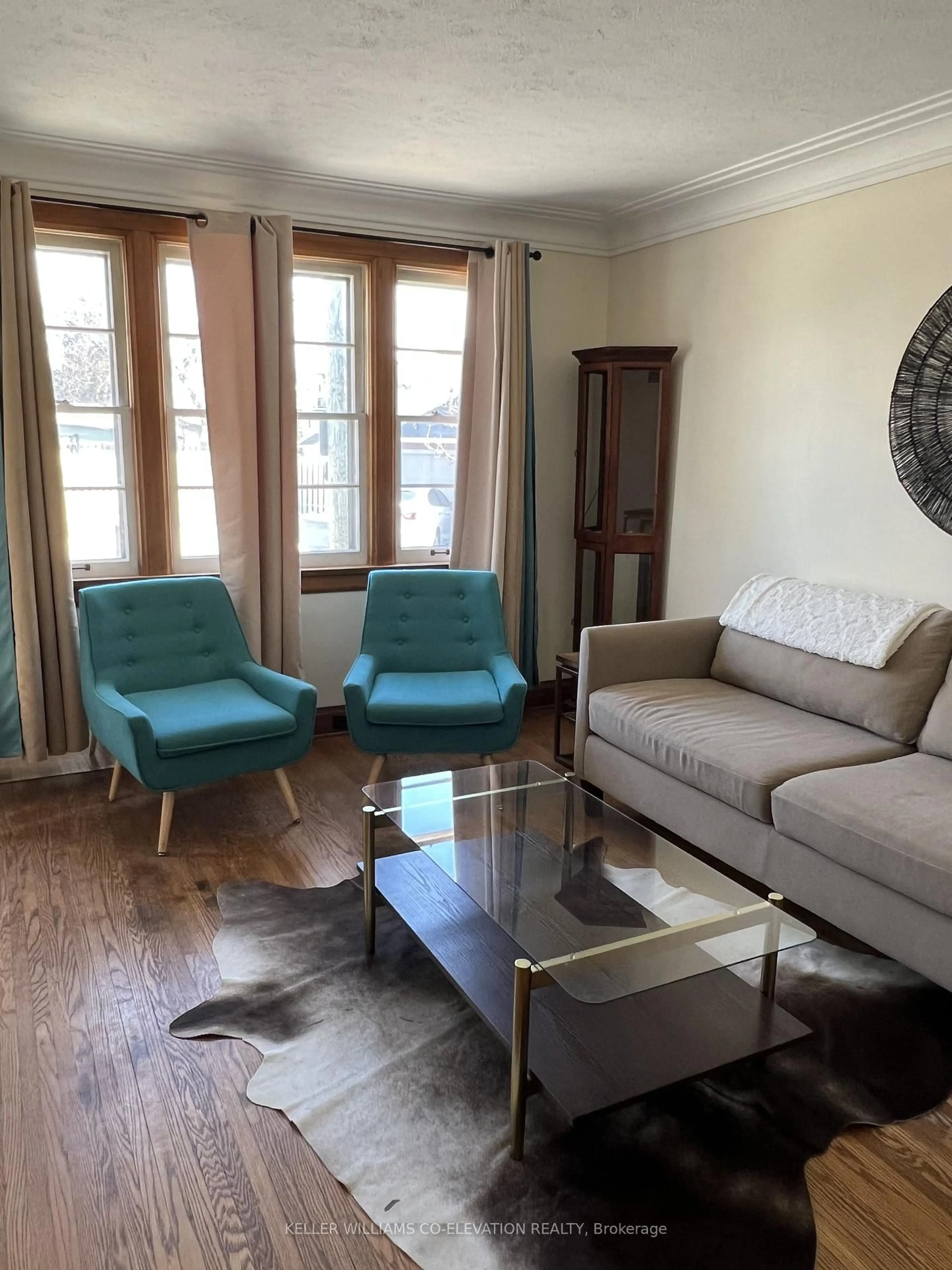 Living room with furniture, wood/laminate floor for 11 VOLLETTE St, St. Catharines Ontario L2R 6L4