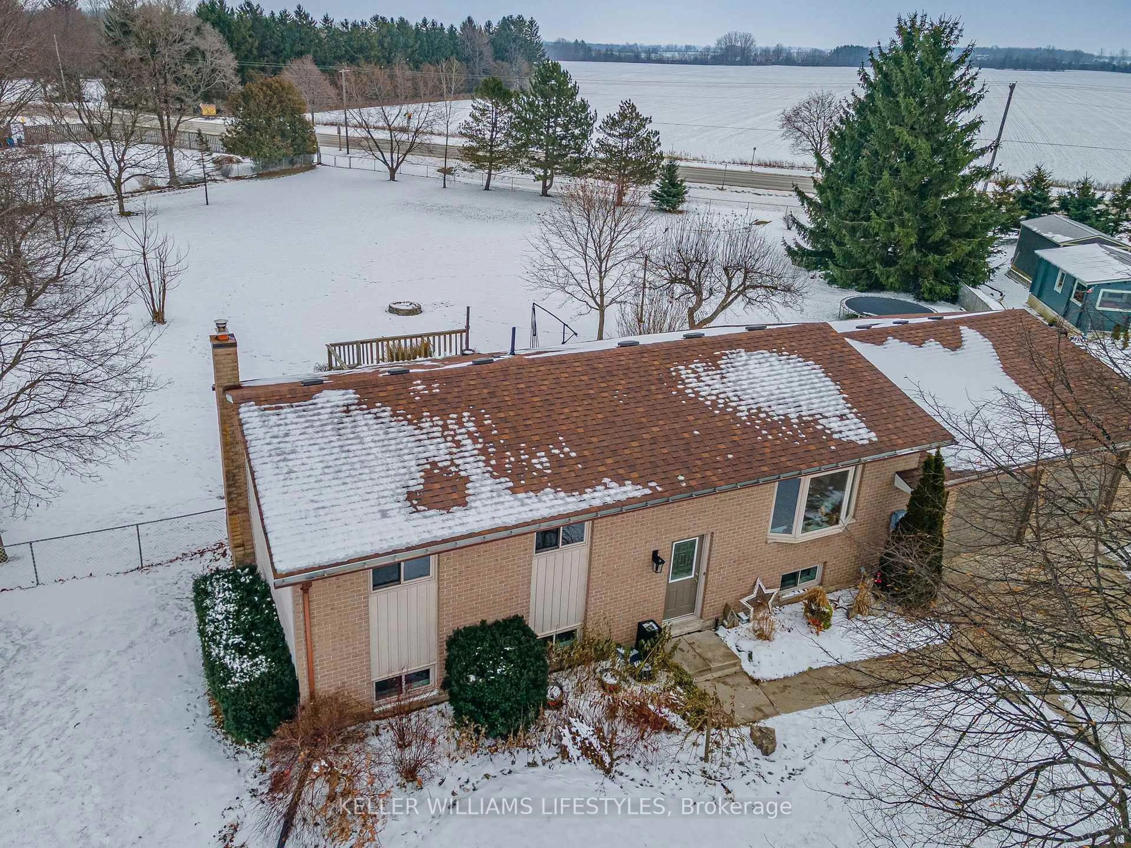 A pic from outside/outdoor area/front of a property/back of a property/a pic from drone, water/lake/river/ocean view for 18 Hawthorn Cres, North Middlesex Ontario N0M 1A0