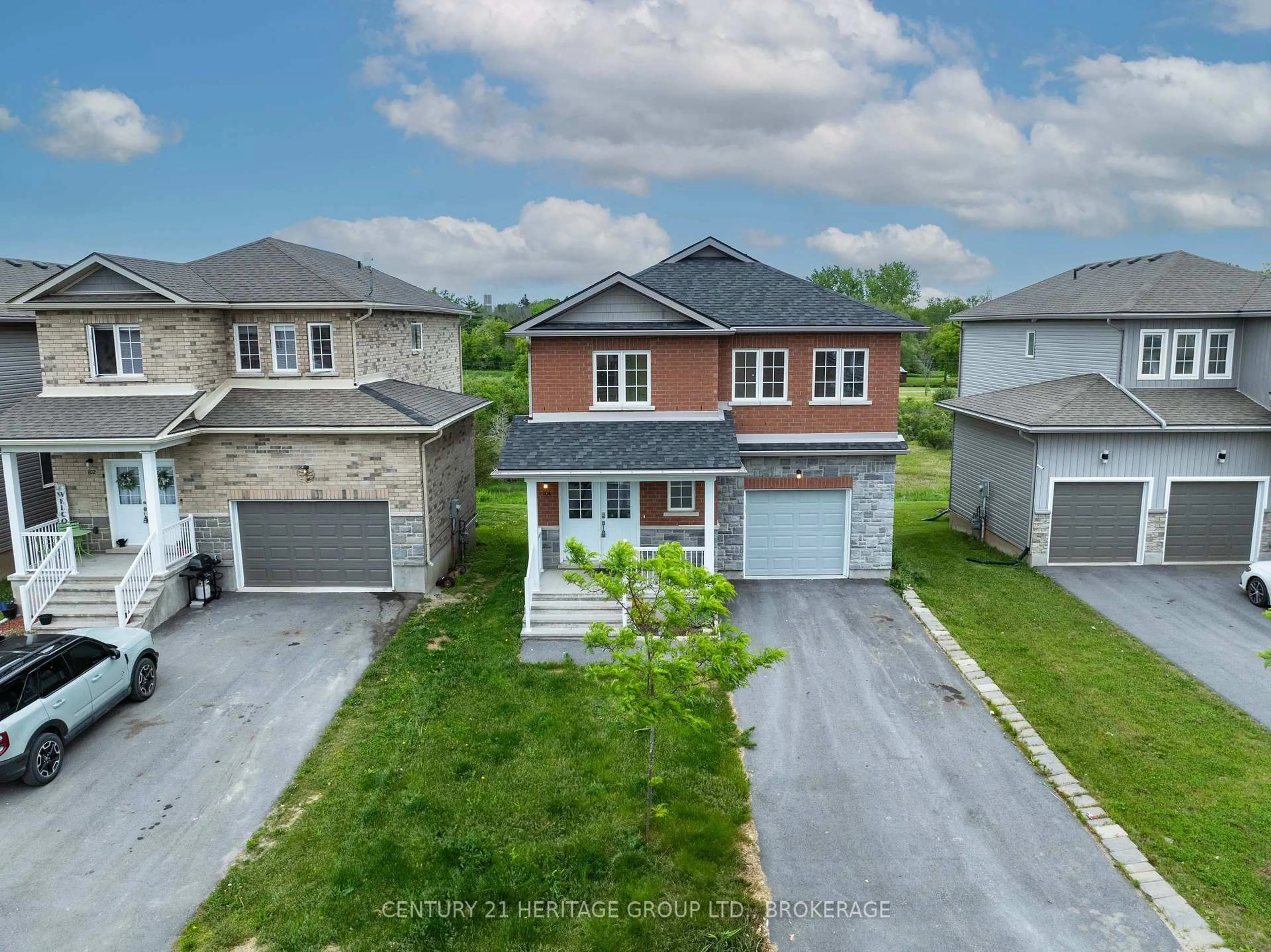 A pic from outside/outdoor area/front of a property/back of a property/a pic from drone, street for 104 Brennan Cres, Bissett Creek Ontario K0H 2H0