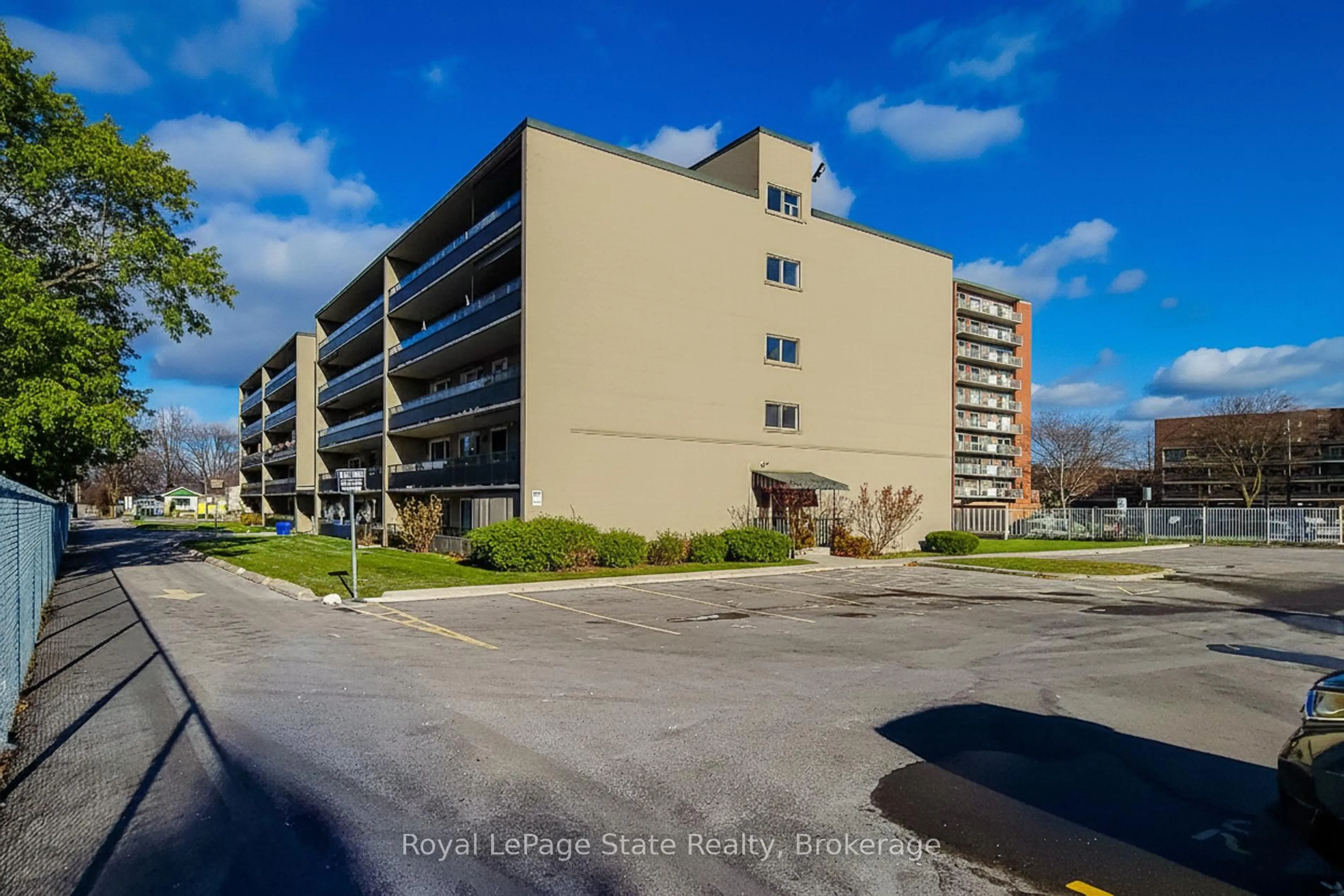 A pic from outside/outdoor area/front of a property/back of a property/a pic from drone, unknown for 510 Queenston Rd #108, Hamilton Ontario L8K 1J3