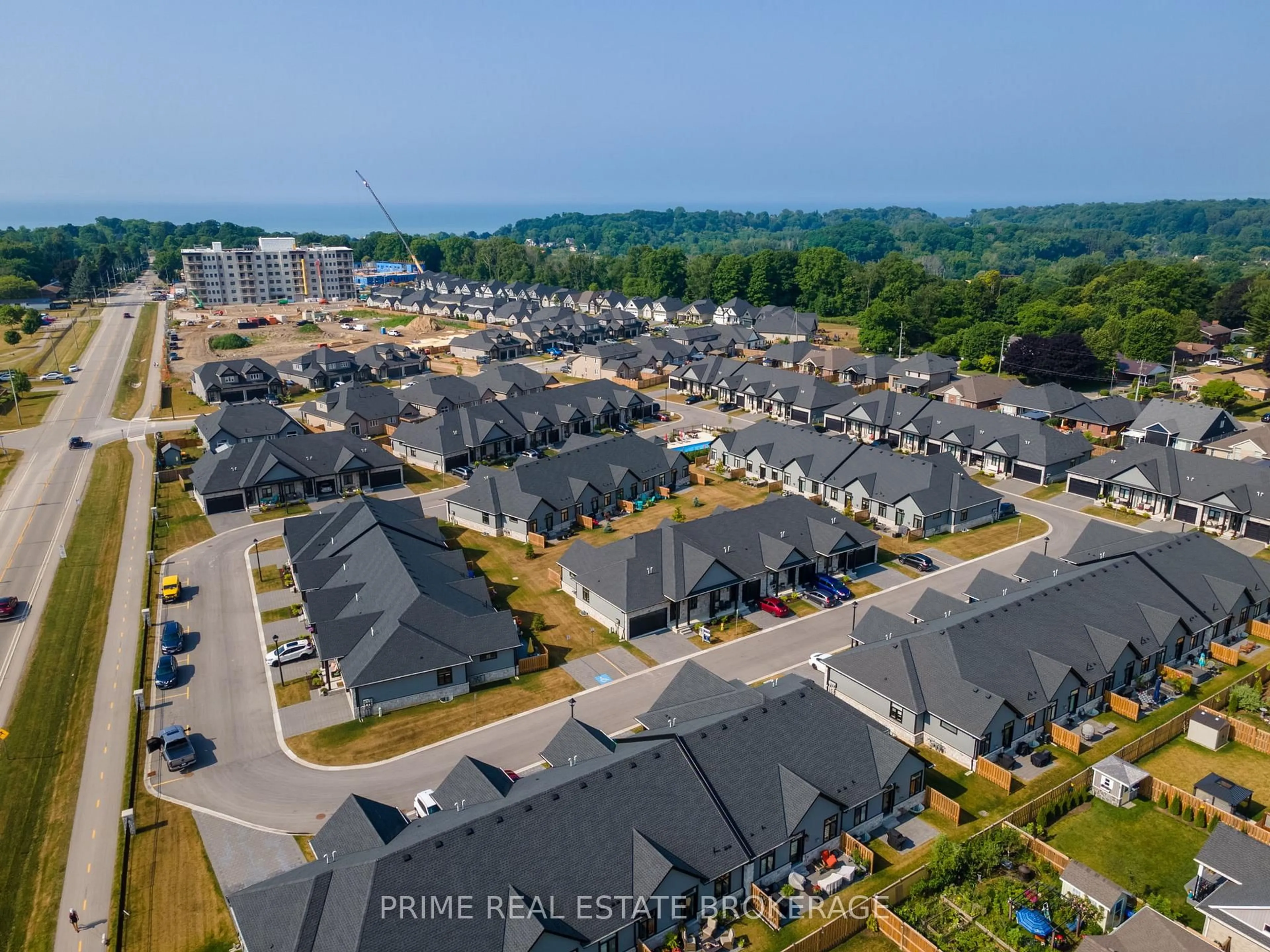 A pic from outside/outdoor area/front of a property/back of a property/a pic from drone, street for 63 Compass Tr #44, Central Elgin Ontario N5L 0B4