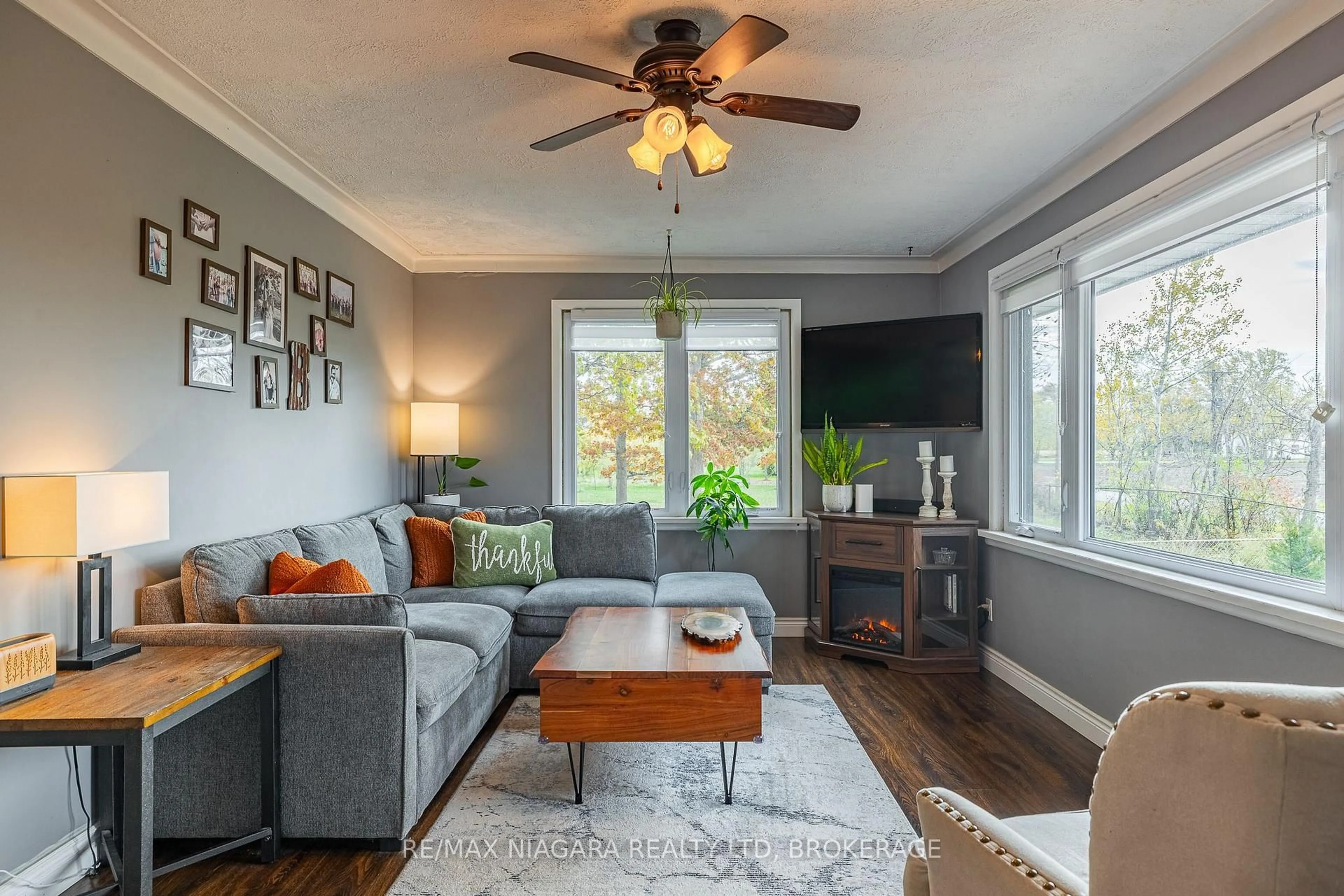 Living room with furniture, wood/laminate floor for 22009 Side Road 20, Wainfleet Ontario L0S 1V0