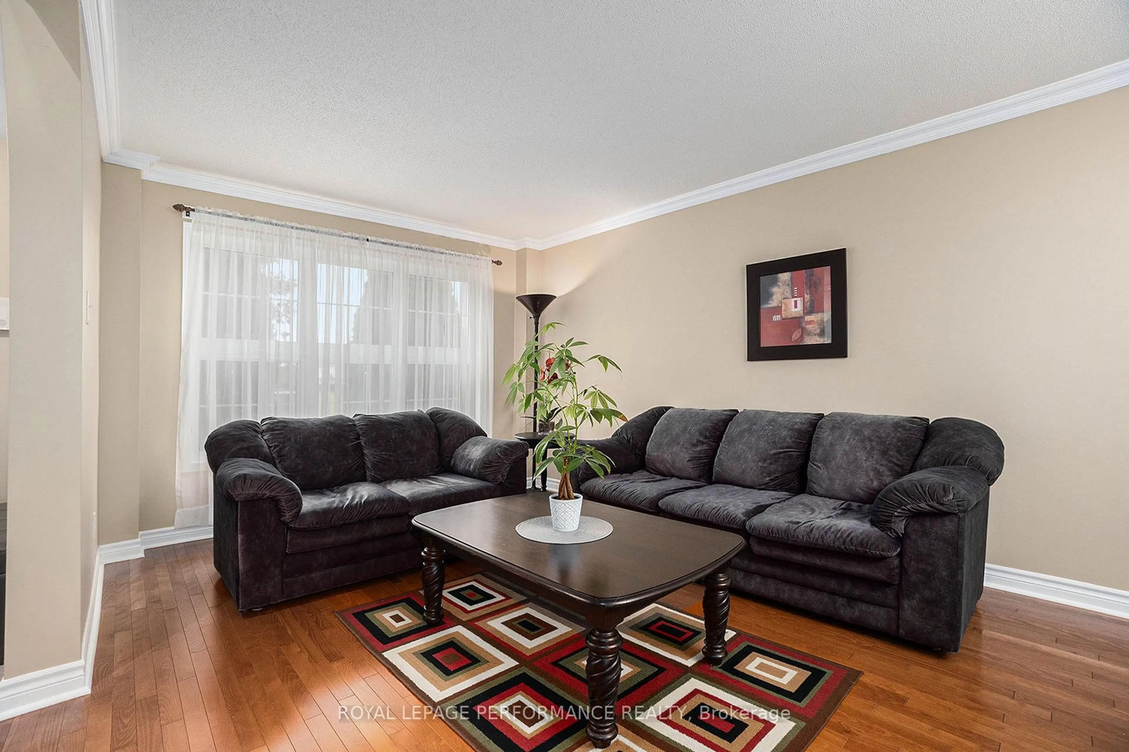 Living room with furniture, wood/laminate floor for 619 Chardonnay Dr, Ottawa Ontario K4A 4K7