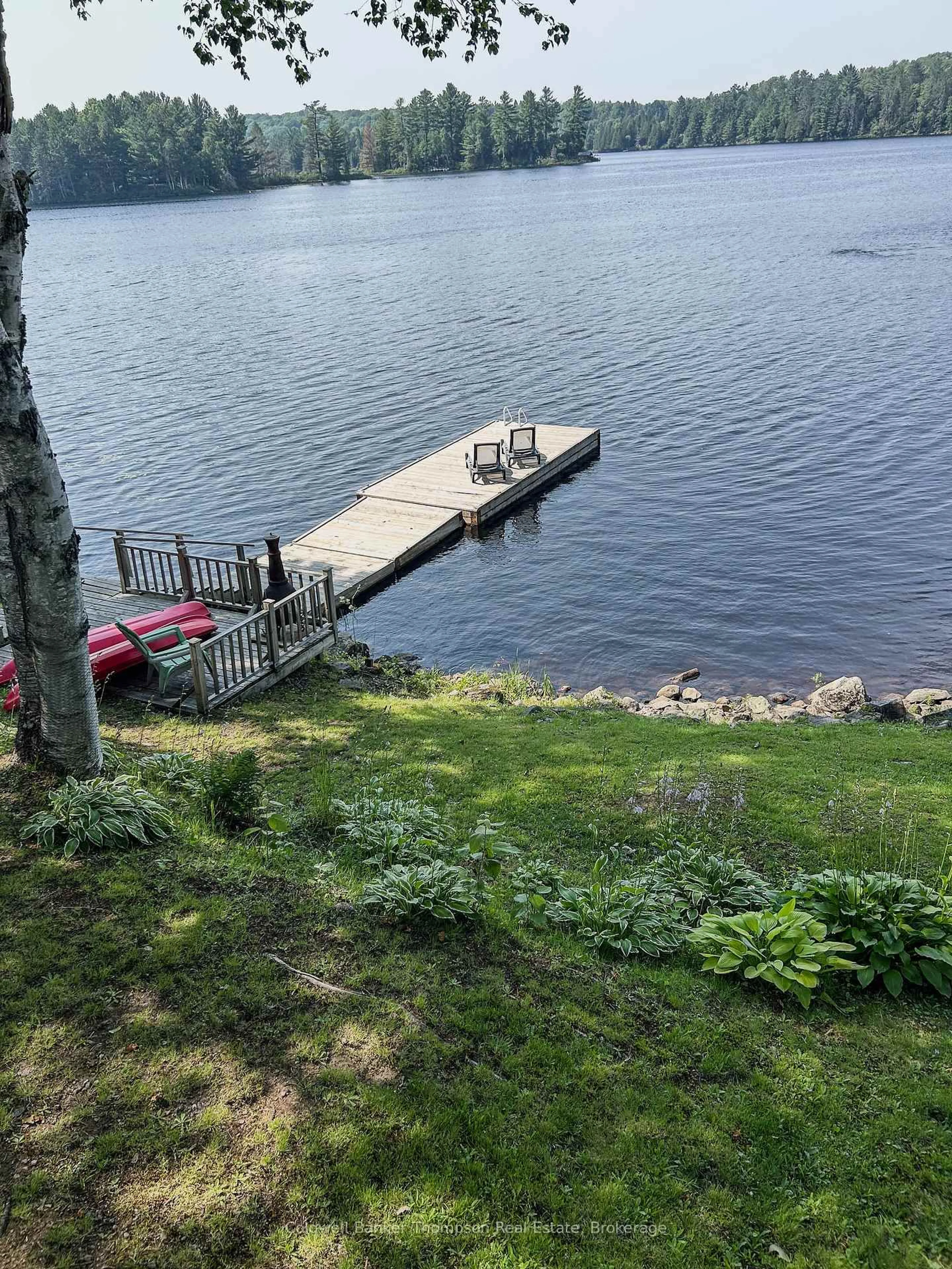 A pic from outside/outdoor area/front of a property/back of a property/a pic from drone, water/lake/river/ocean view for 26 Spruce Lane, Magnetawan Ontario P0A 1C0