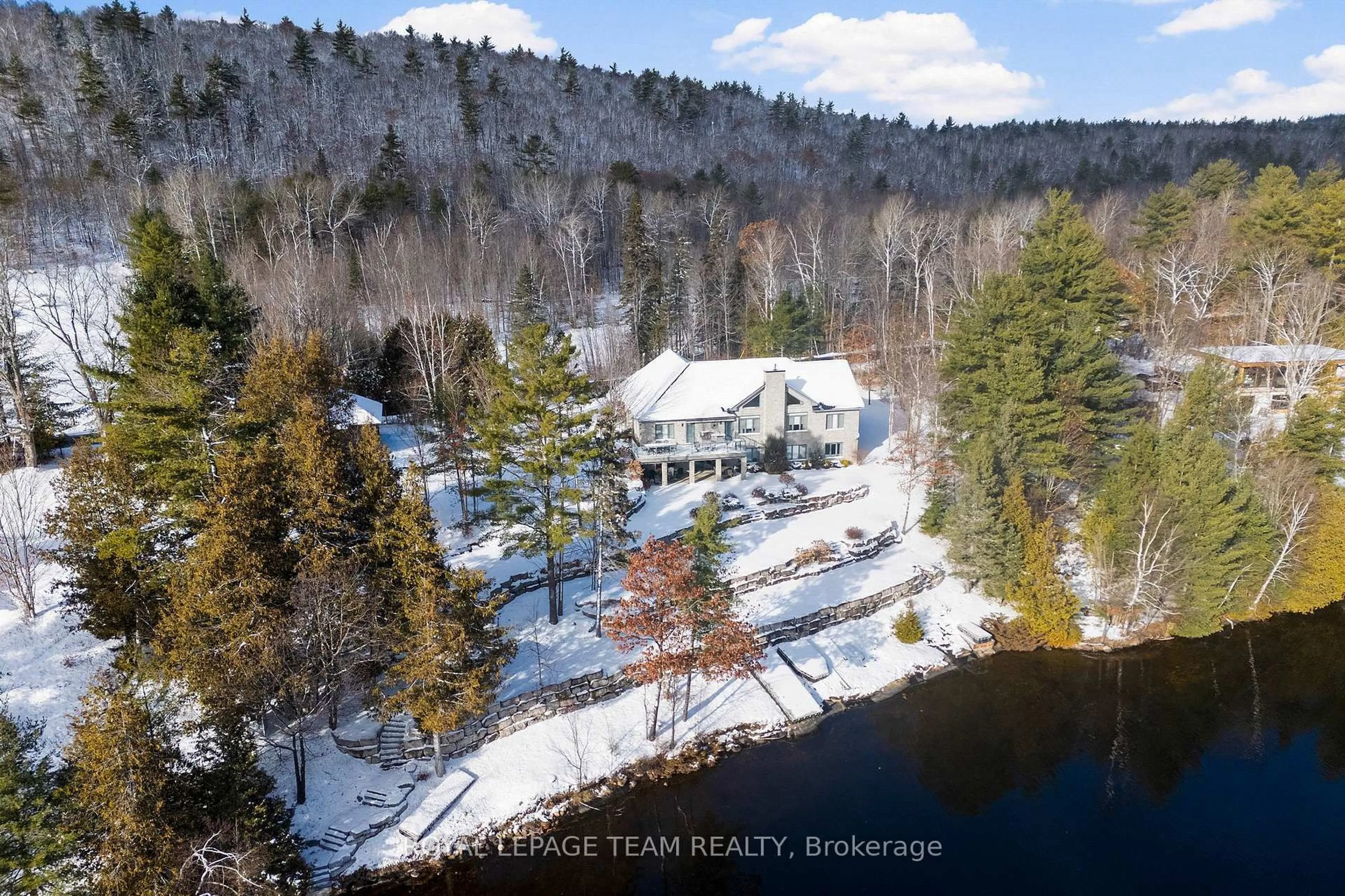 A pic from outside/outdoor area/front of a property/back of a property/a pic from drone, water/lake/river/ocean view for 2803 Centennial Lake Rd, Calabogie Ontario K0J 1H0