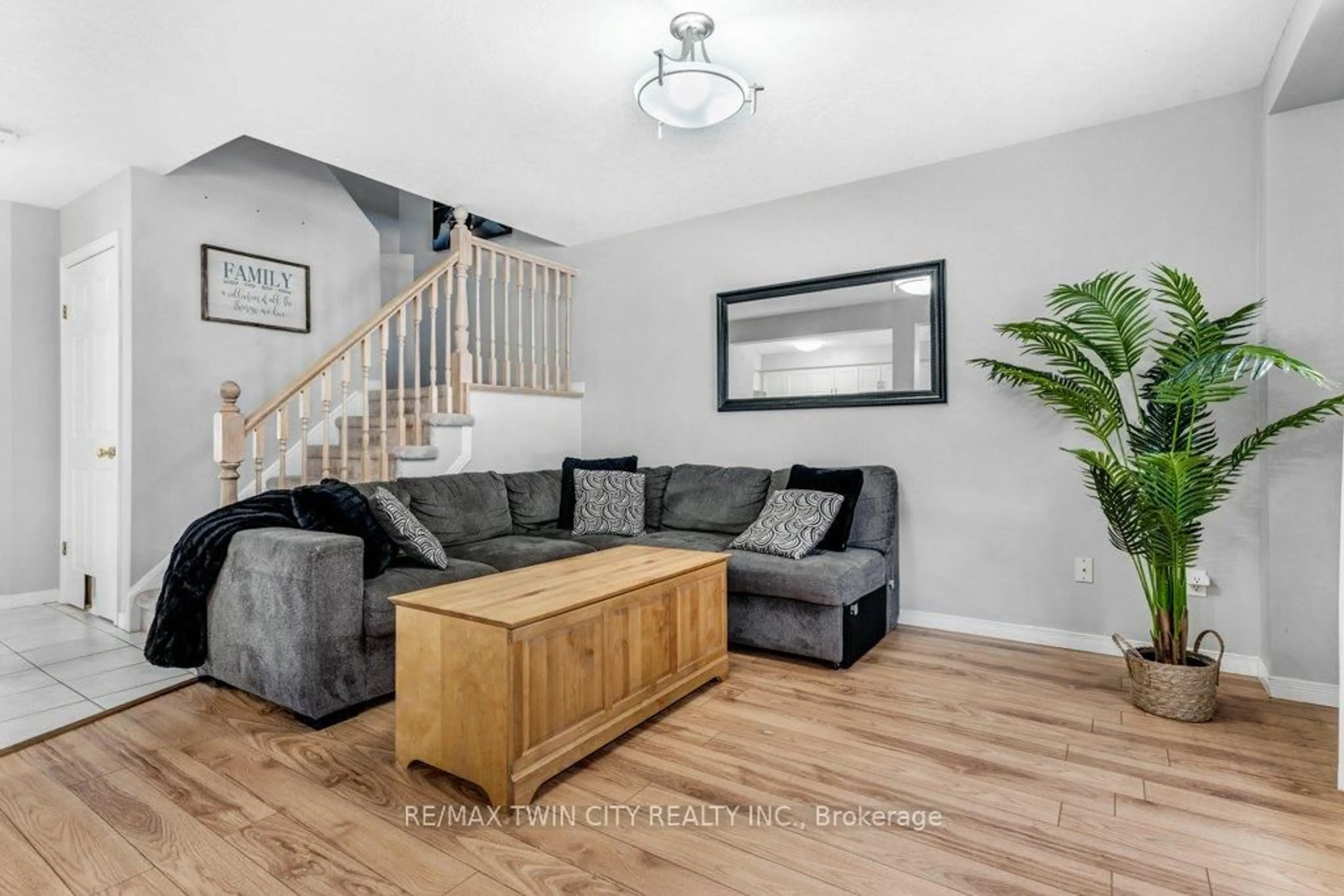 Living room with furniture, wood/laminate floor for 102 Marston Cres, Cambridge Ontario N3C 4G4
