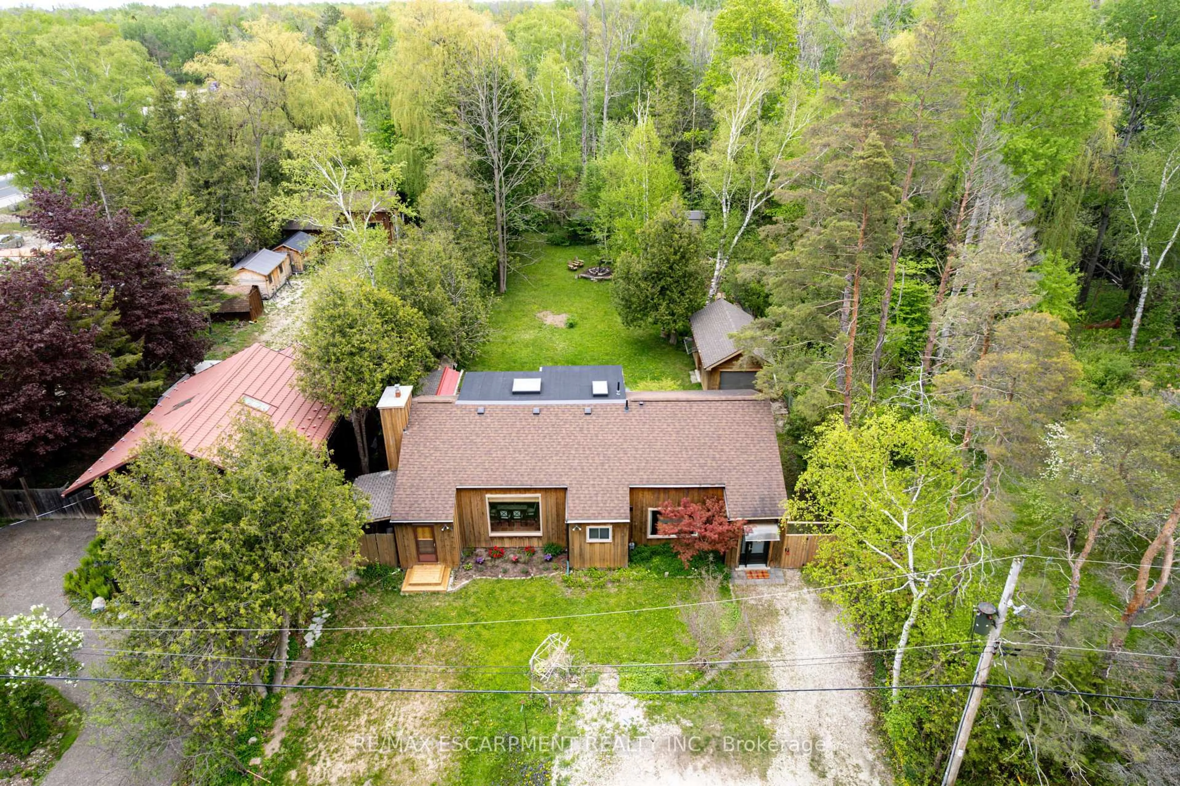 A pic from outside/outdoor area/front of a property/back of a property/a pic from drone, forest/trees view for 109 Hope St, Blue Mountains Ontario L9Y 0L1