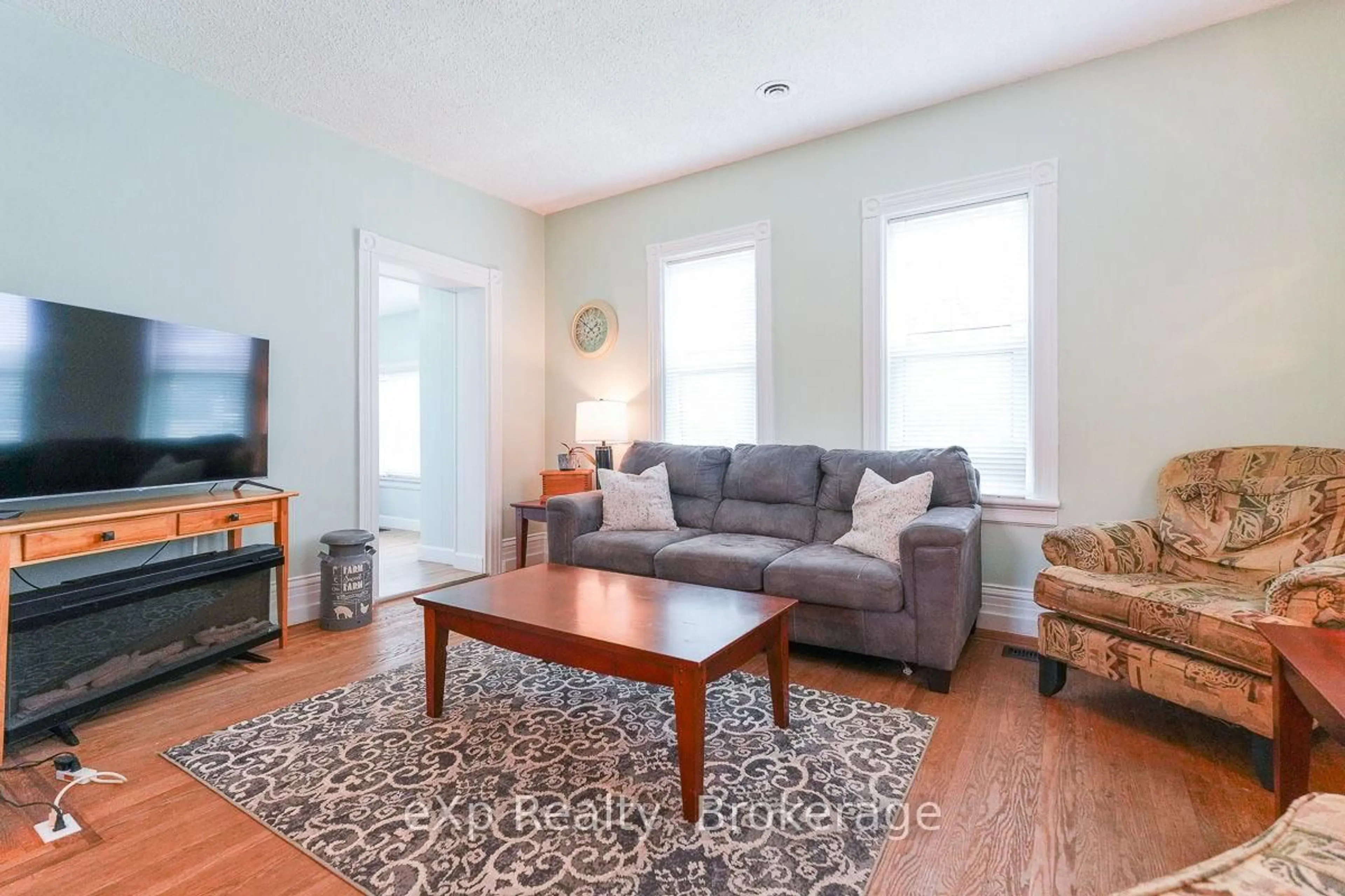 Living room with furniture, wood/laminate floor for 594 10th A St, Owen Sound Ontario N4K 3R6