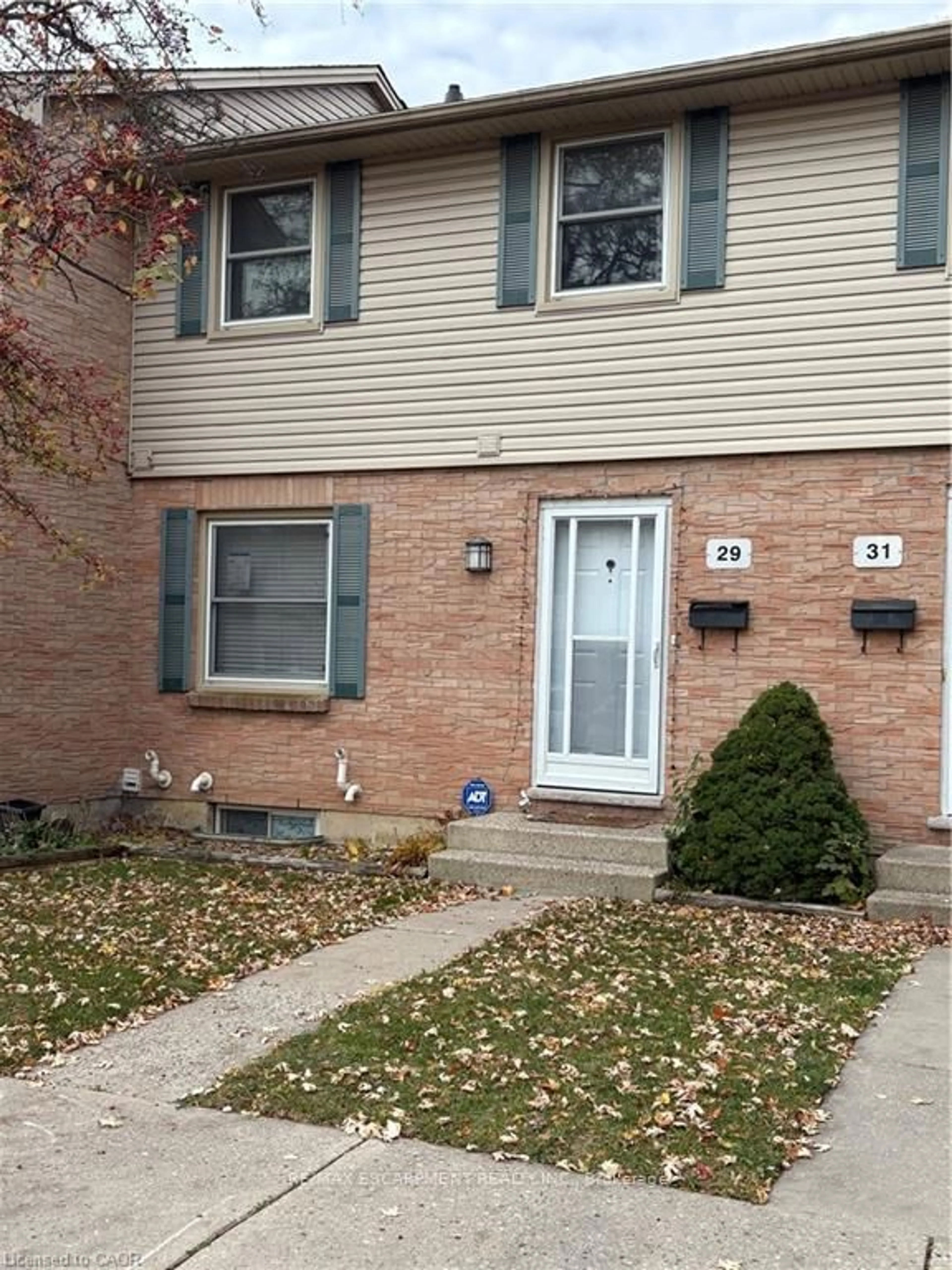 Home with vinyl exterior material, street for 1247 HURON St #29, London East Ontario L8G 3Z2