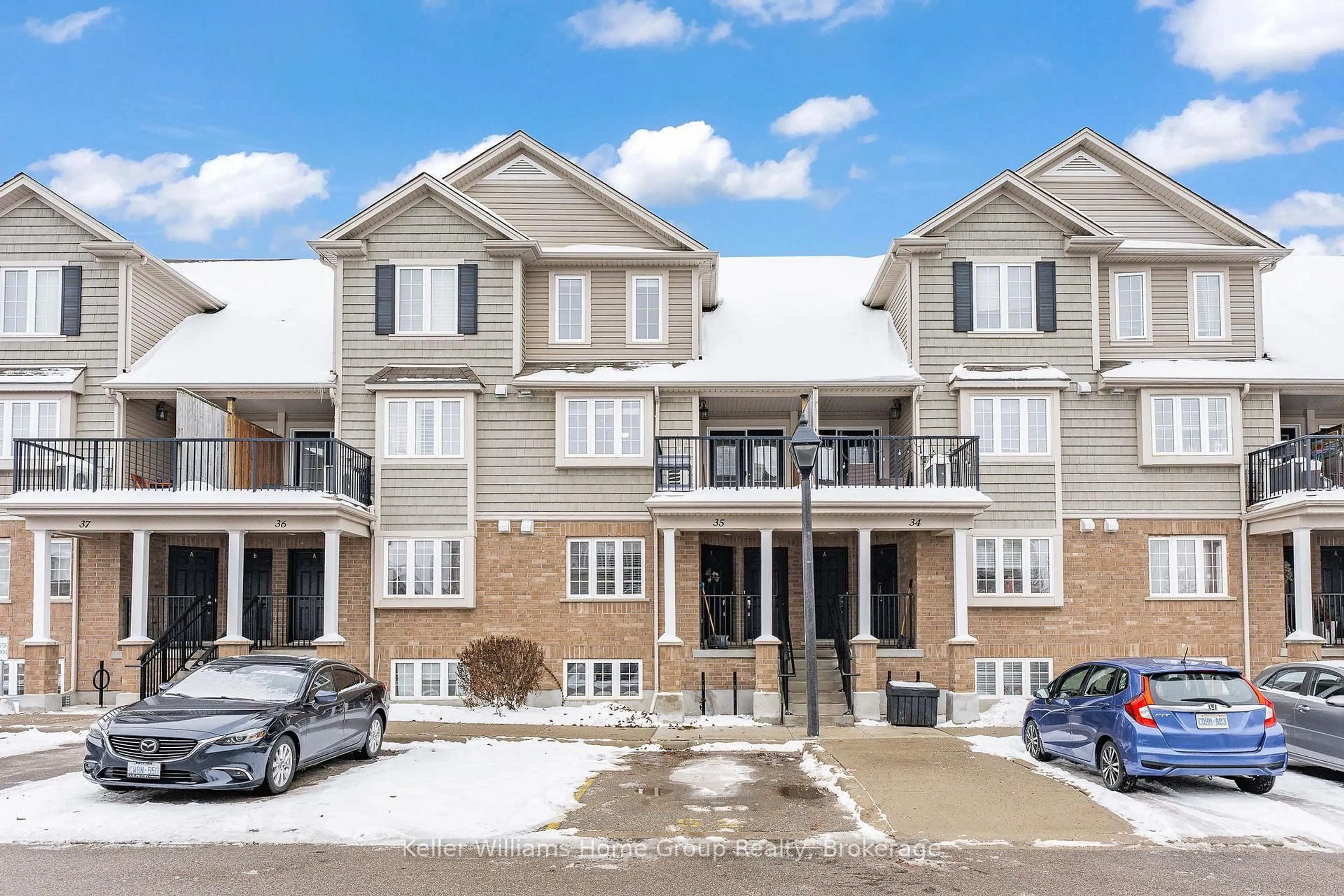 A pic from outside/outdoor area/front of a property/back of a property/a pic from drone, street for 15 Carere Cres #35B, Guelph Ontario N1E 0K4