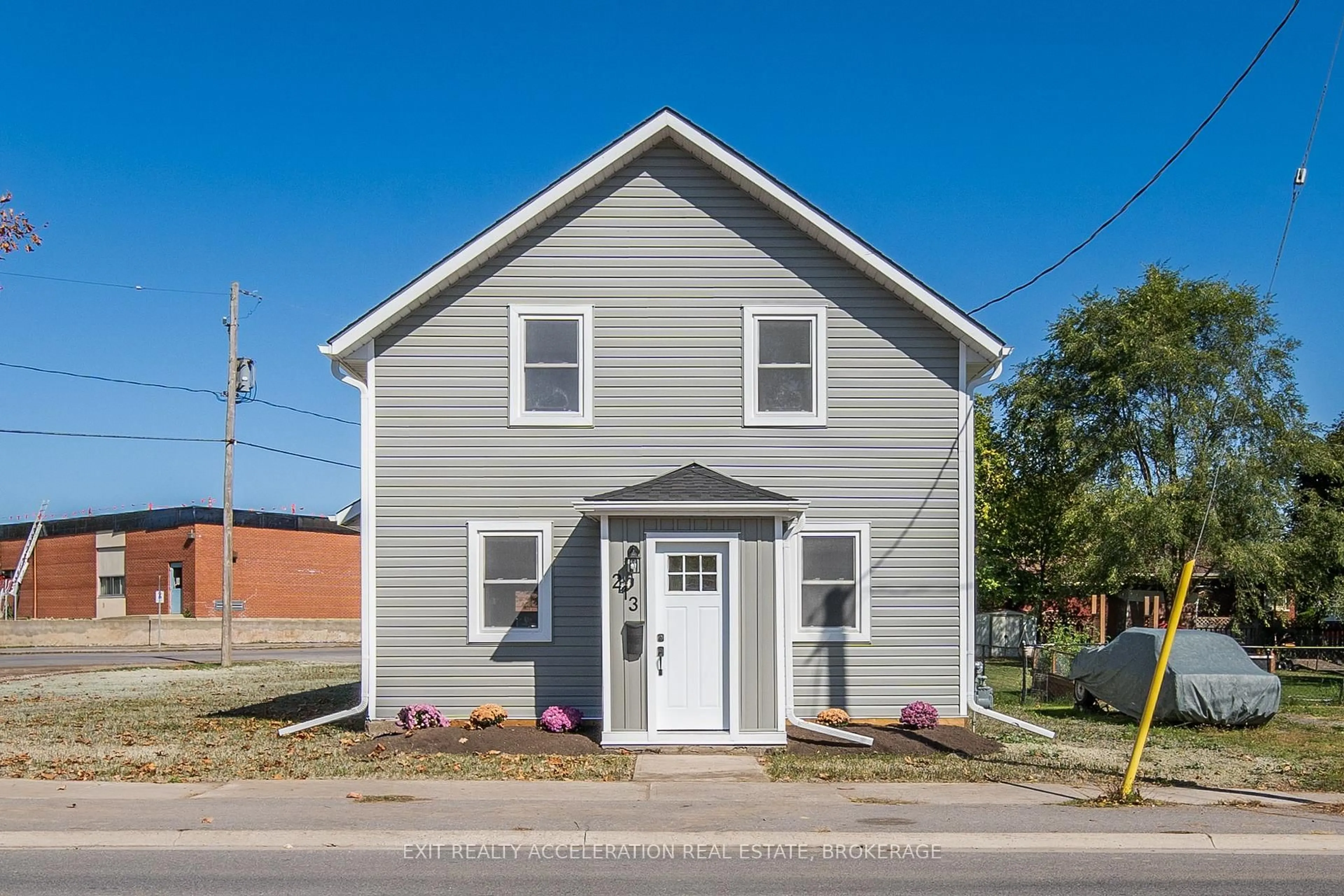 Home with vinyl exterior material, street for 213 Belleville Rd, Greater Napanee Ontario K7R 2R4