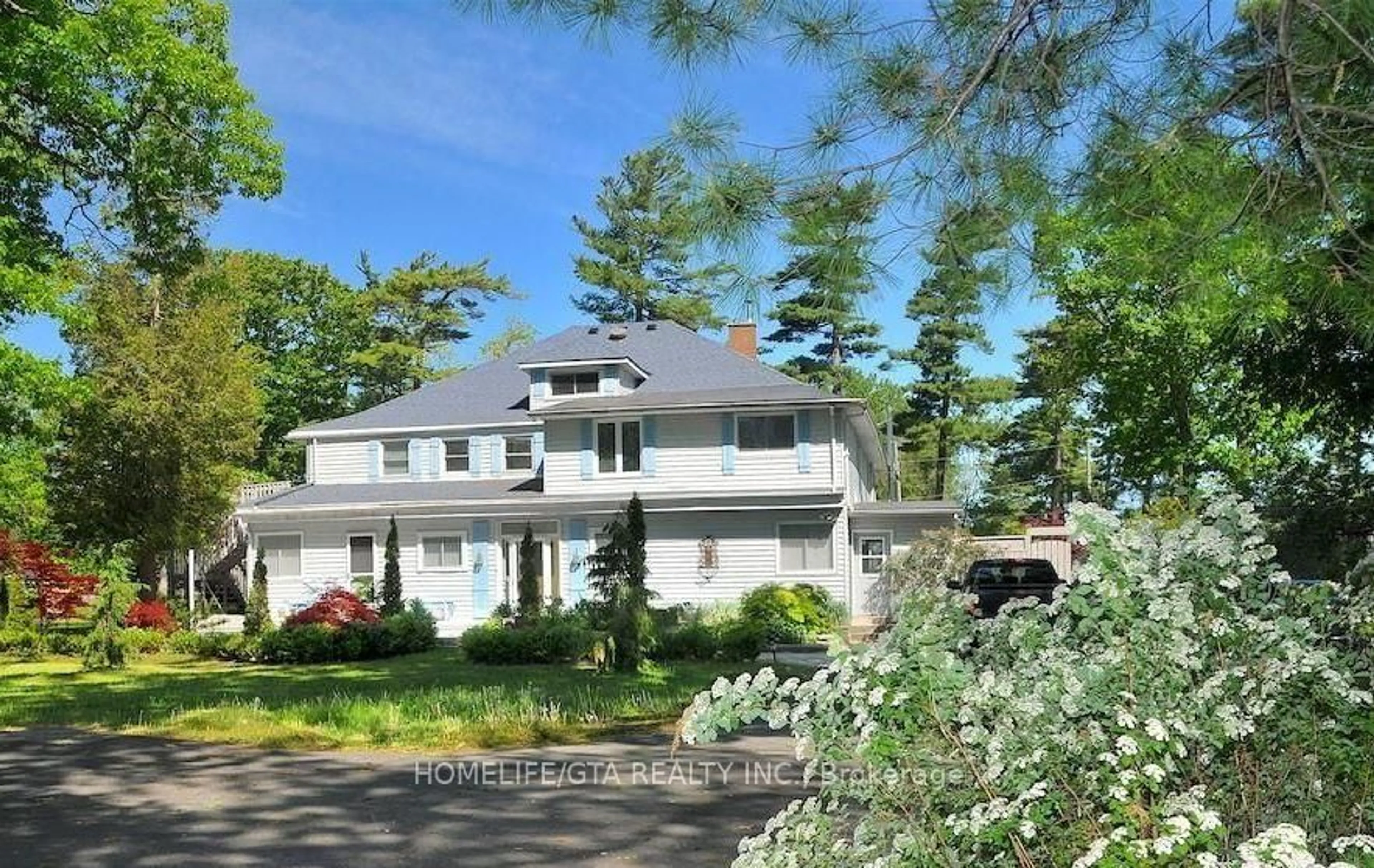 A pic from outside/outdoor area/front of a property/back of a property/a pic from drone, street for 136 12 O'clock Point Rd, Quinte West Ontario K0K 1L0