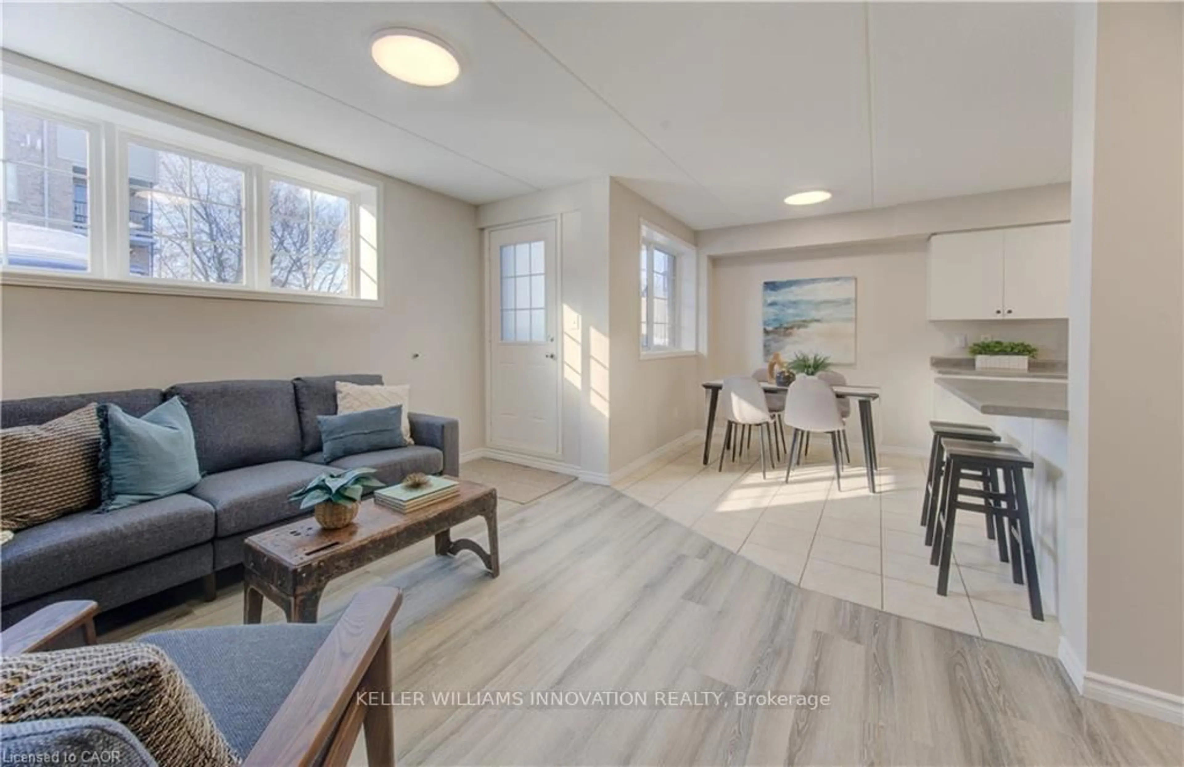 Living room with furniture, wood/laminate floor for 12 Holborn Dr #E33, Kitchener Ontario N2A 0A4