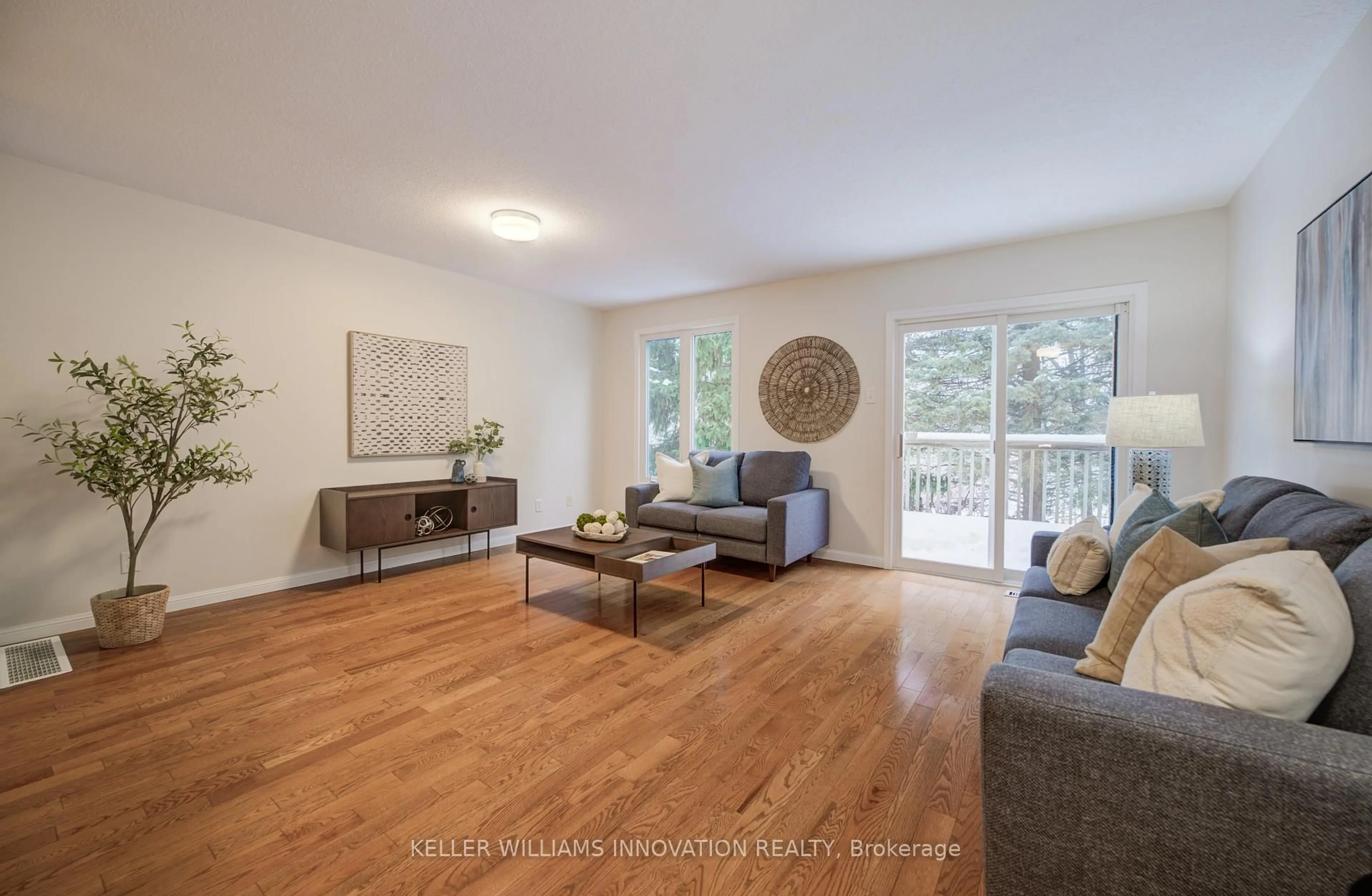 Living room with furniture, wood/laminate floor for 194 Windflower Dr, Kitchener Ontario N2E 3T2