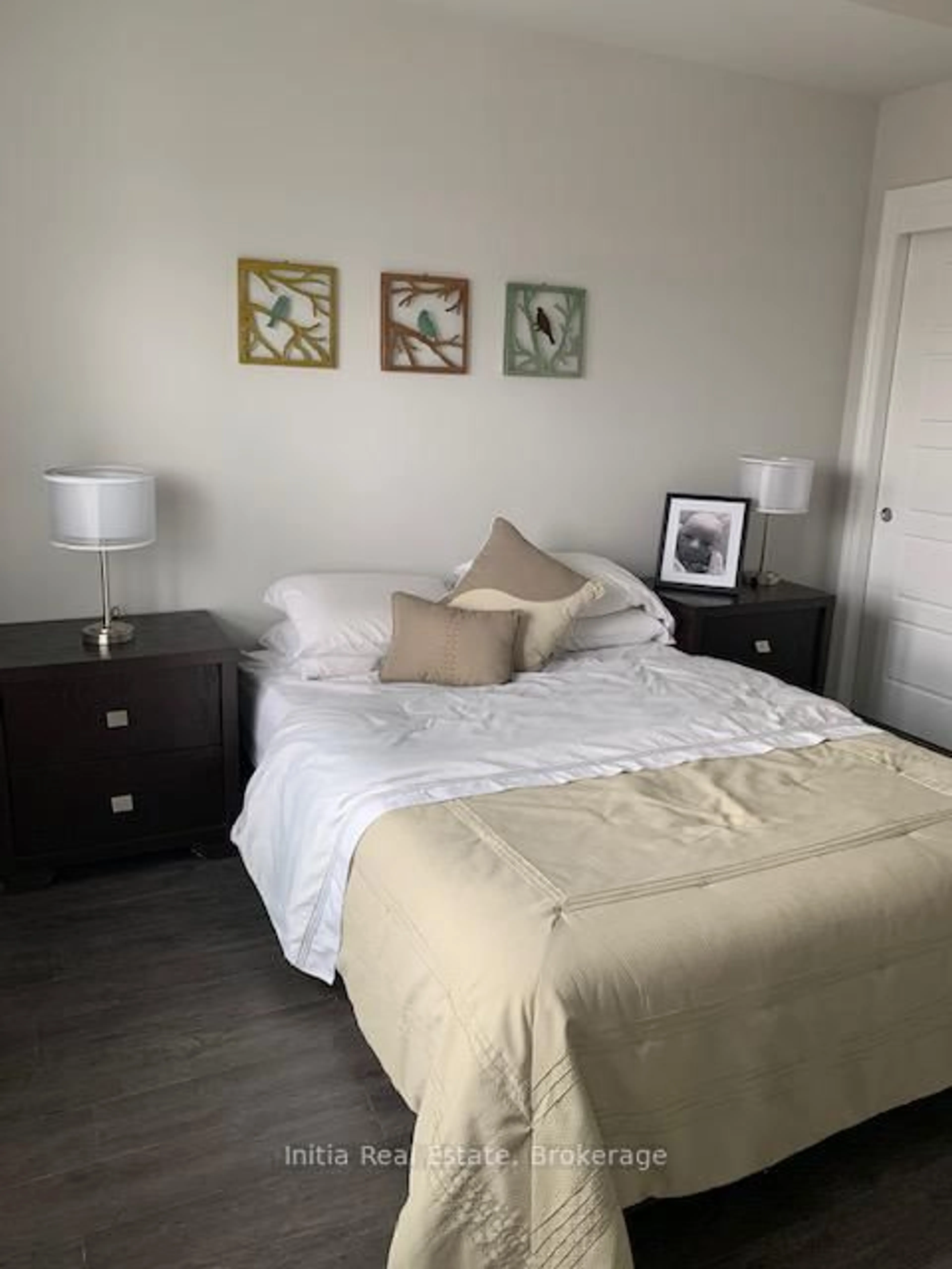 Bedroom with bed, wood/laminate floor for 35 Kingsbury Sq #323, Guelph Ontario N1L 0J4