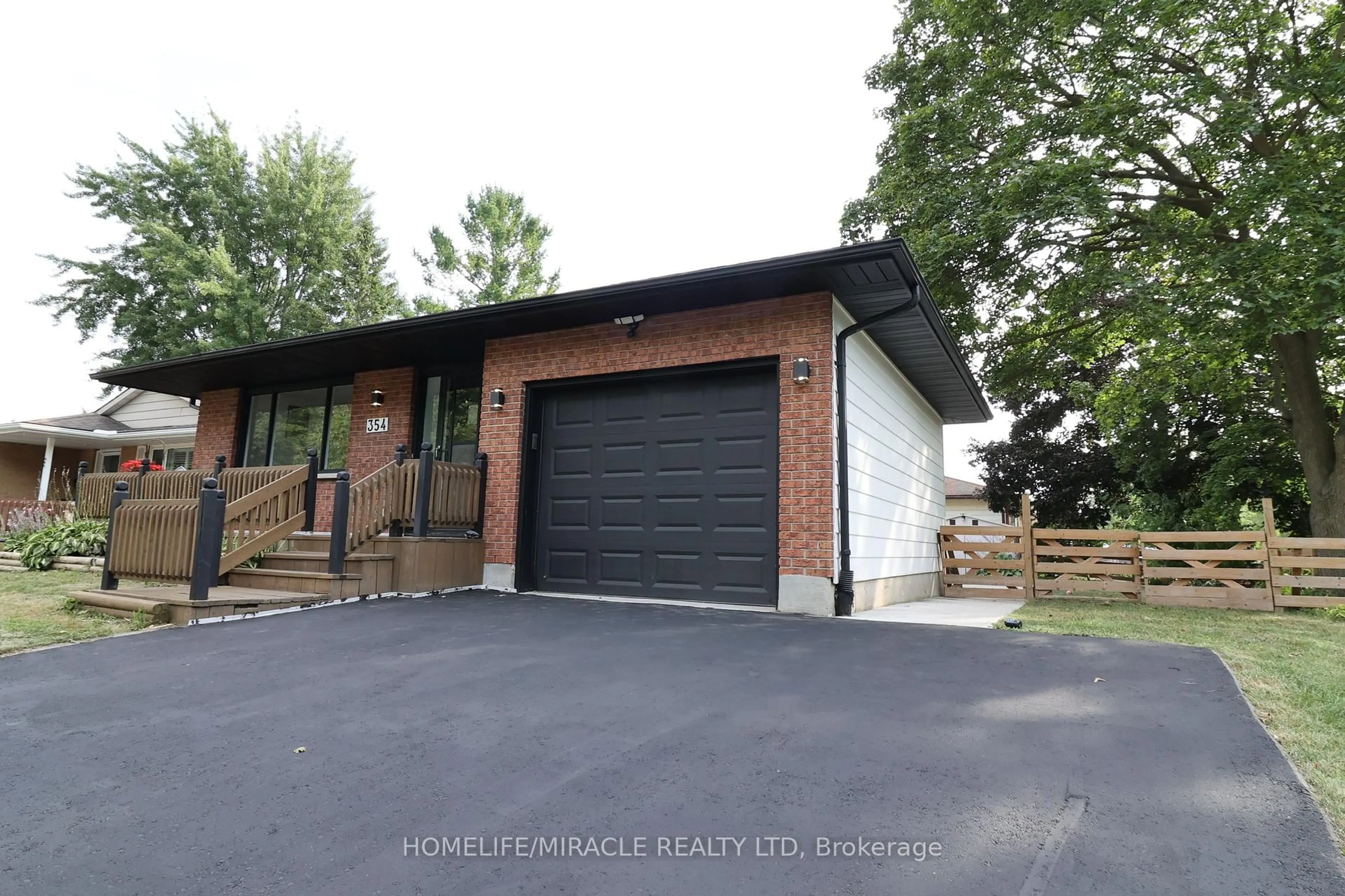 Home with brick exterior material, street for 354 Lee Circ, Waterloo Ontario N2K 2L9