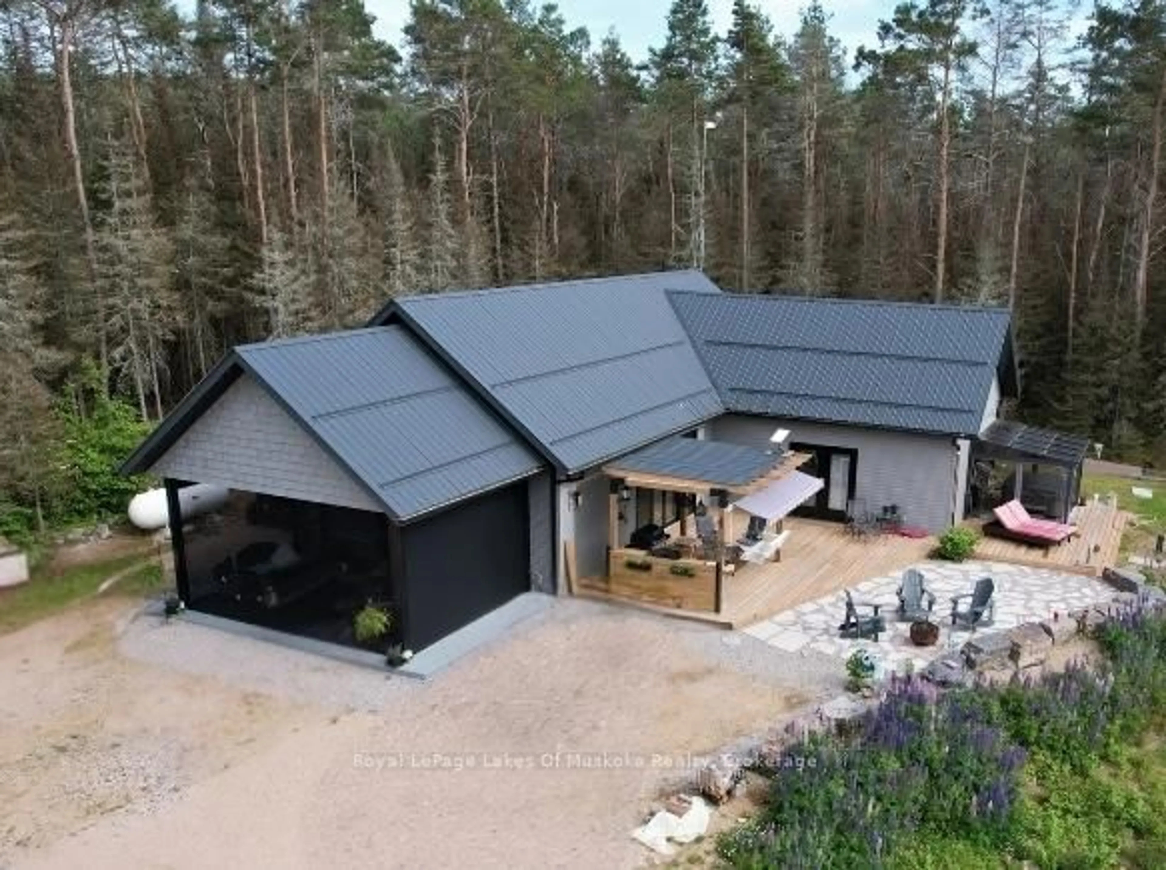 A pic from outside/outdoor area/front of a property/back of a property/a pic from drone, unknown for 679 Boulder Rd, South River Ontario P0A 1X0