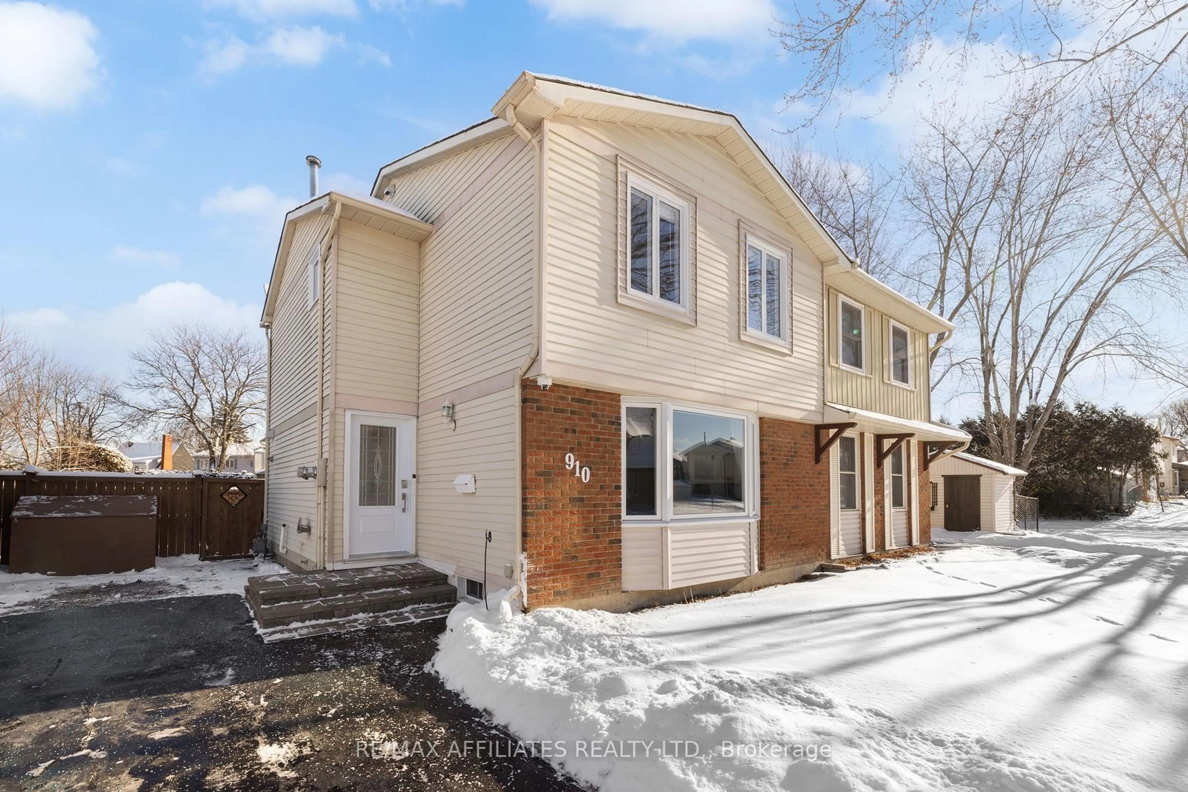 Home with brick exterior material, street for 910 Borland Dr, Orleans Ontario K1E 1X6