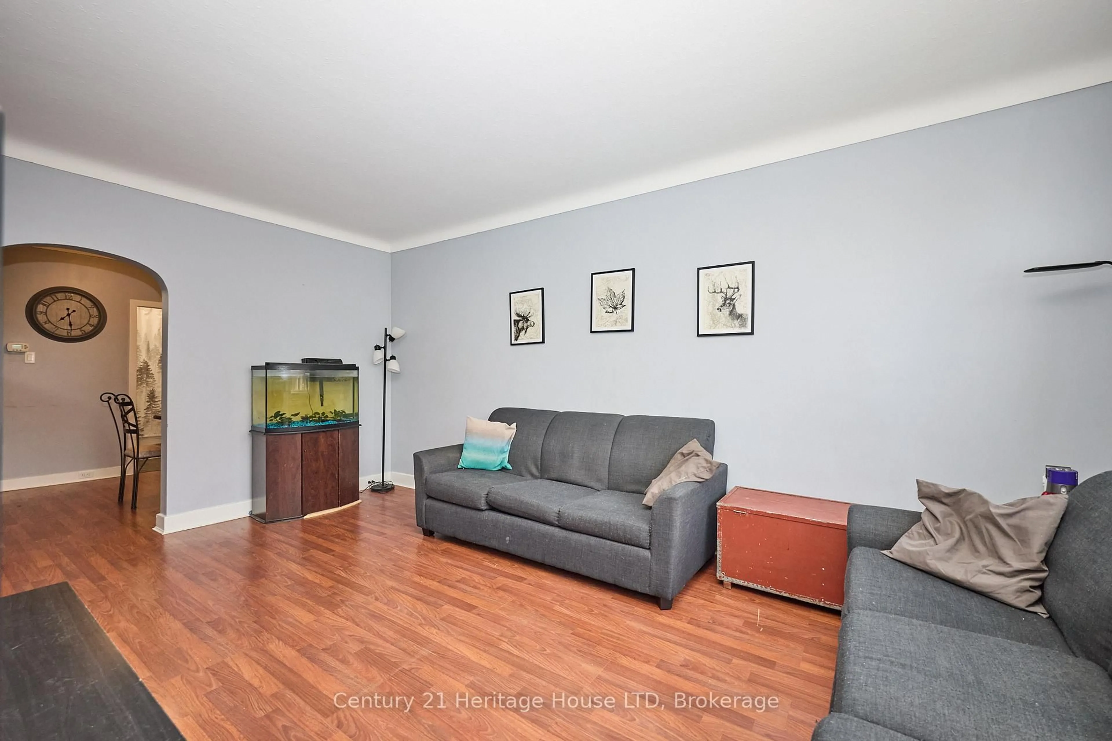Living room with furniture, wood/laminate floor for 78 Rodman St, St. Catharines Ontario L2R 5E2