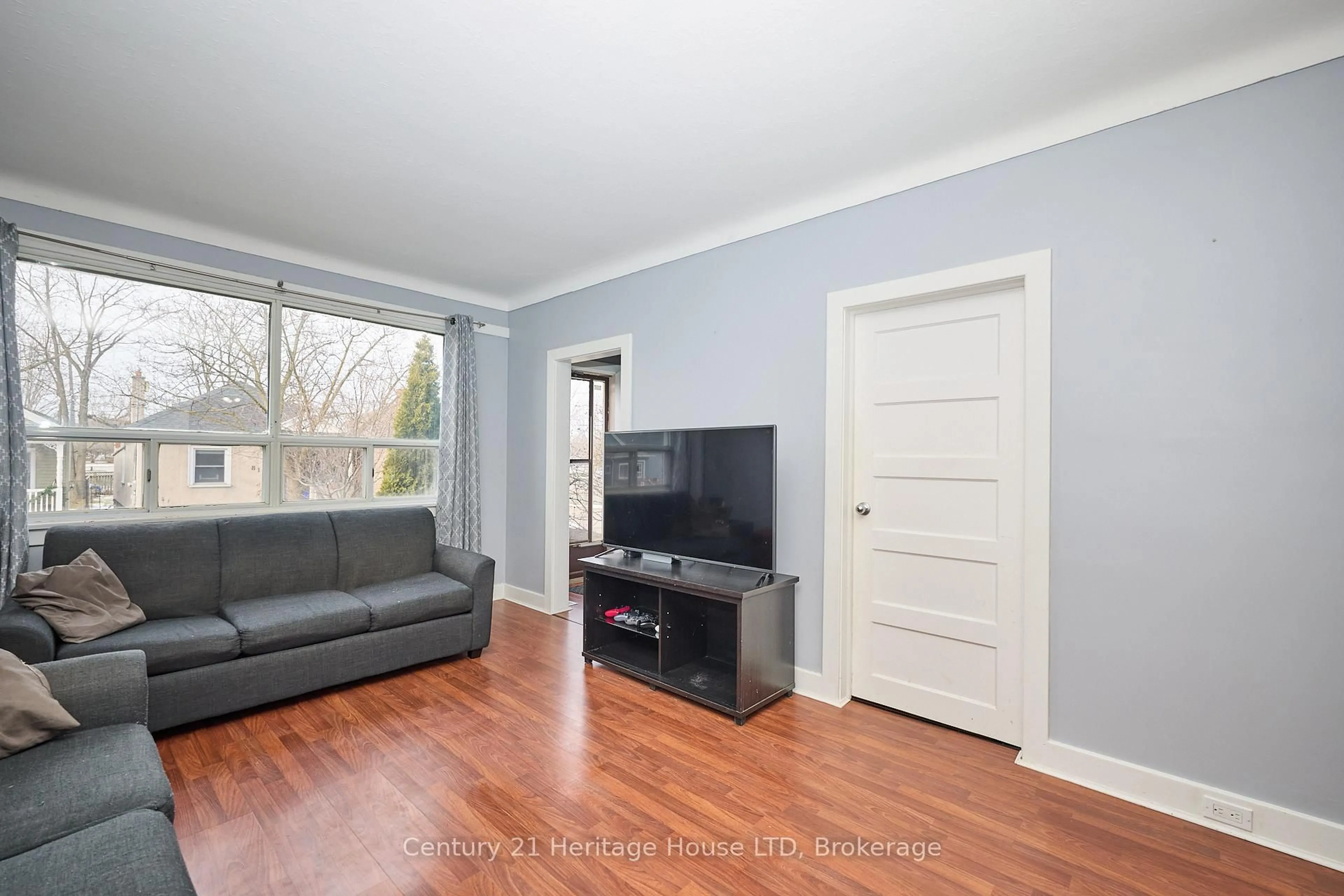 Living room with furniture, wood/laminate floor for 78 Rodman St, St. Catharines Ontario L2R 5E2