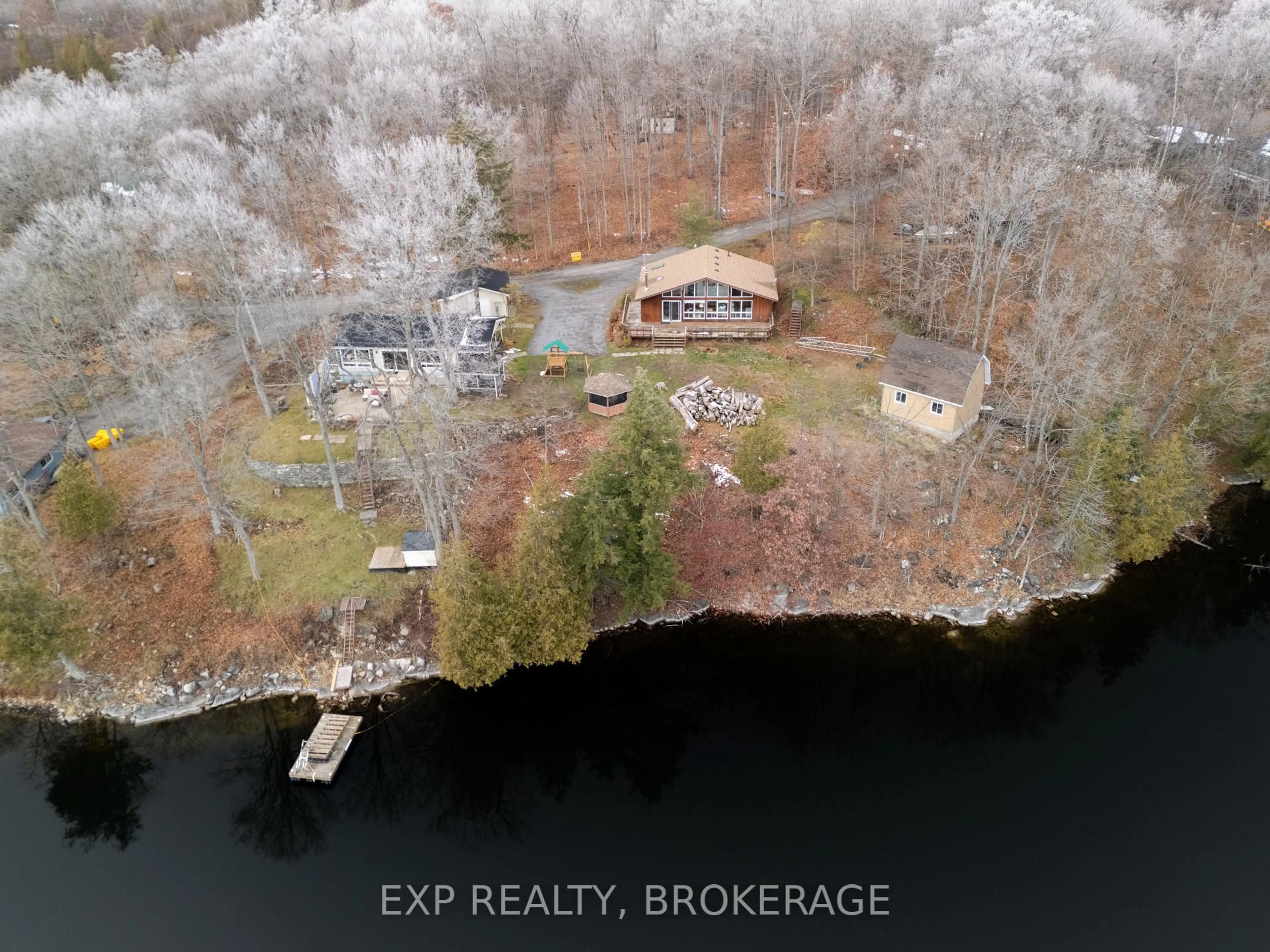 A pic from outside/outdoor area/front of a property/back of a property/a pic from drone, water/lake/river/ocean view for 2103 Hambly Lane, Hartington Ontario K0H 1W0