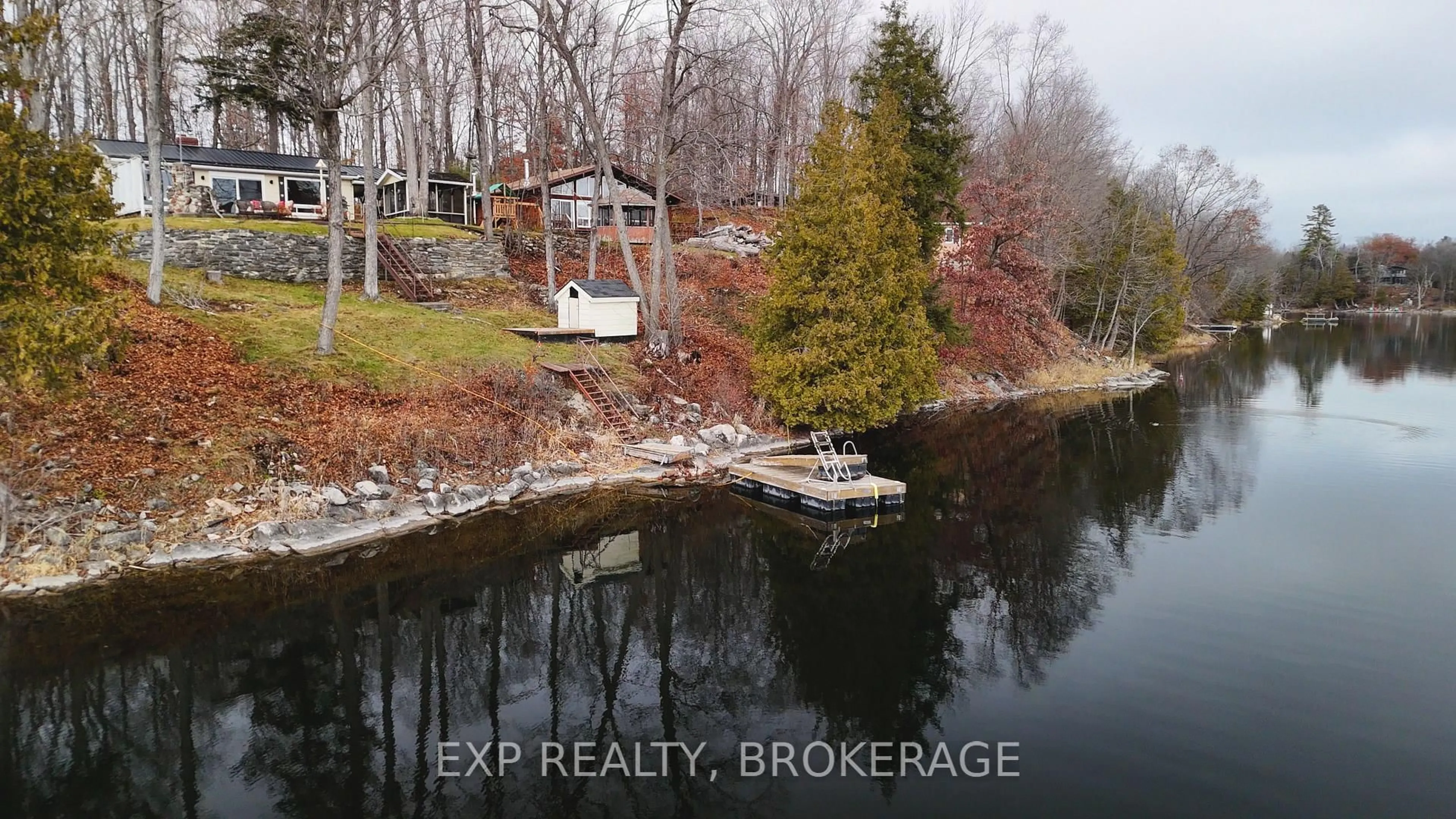 A pic from outside/outdoor area/front of a property/back of a property/a pic from drone, water/lake/river/ocean view for 2103 Hambly Lane, Hartington Ontario K0H 1W0