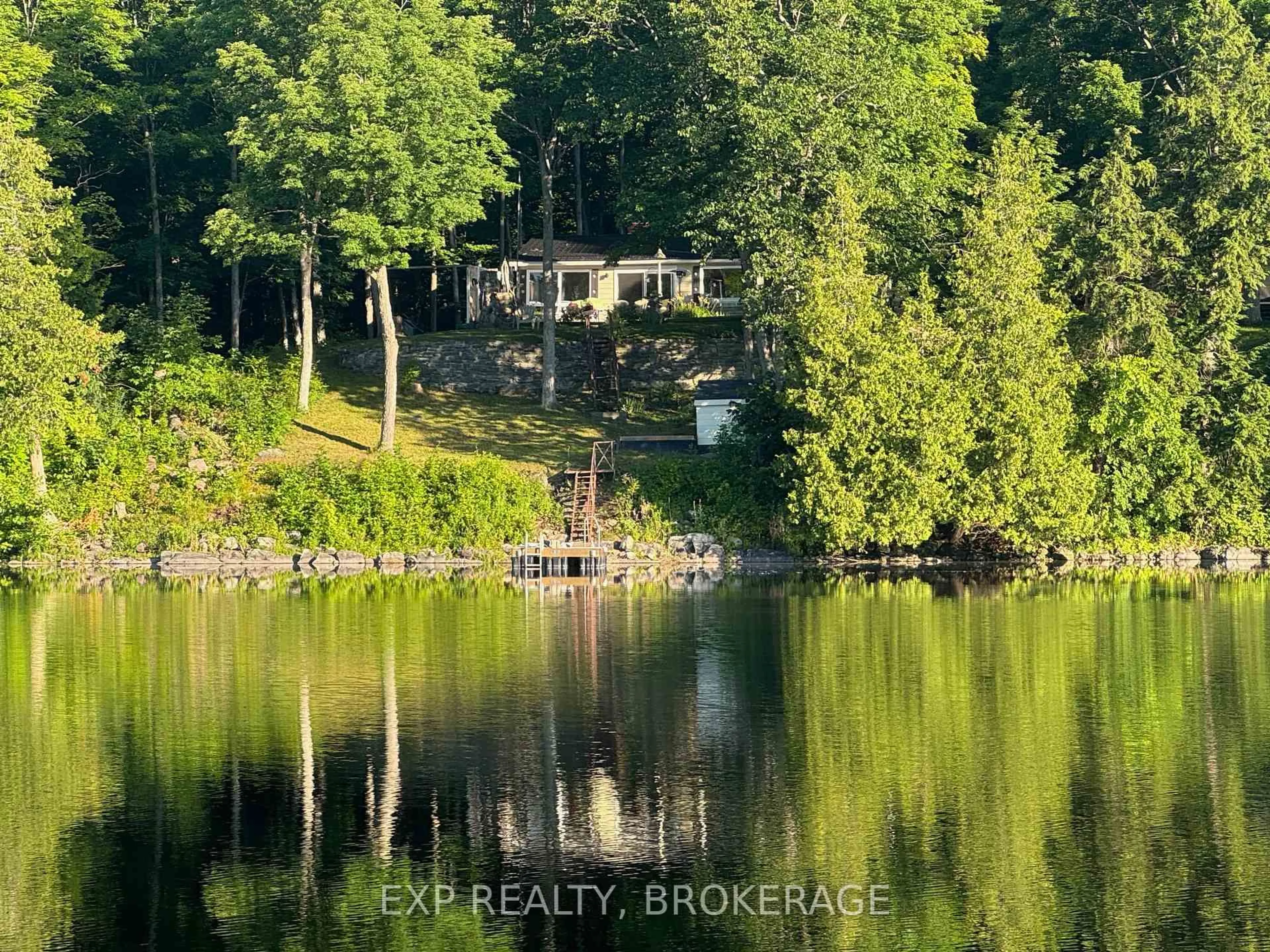 A pic from outside/outdoor area/front of a property/back of a property/a pic from drone, water/lake/river/ocean view for 2107 Hambly Lane, Hartington Ontario K0H 1W0