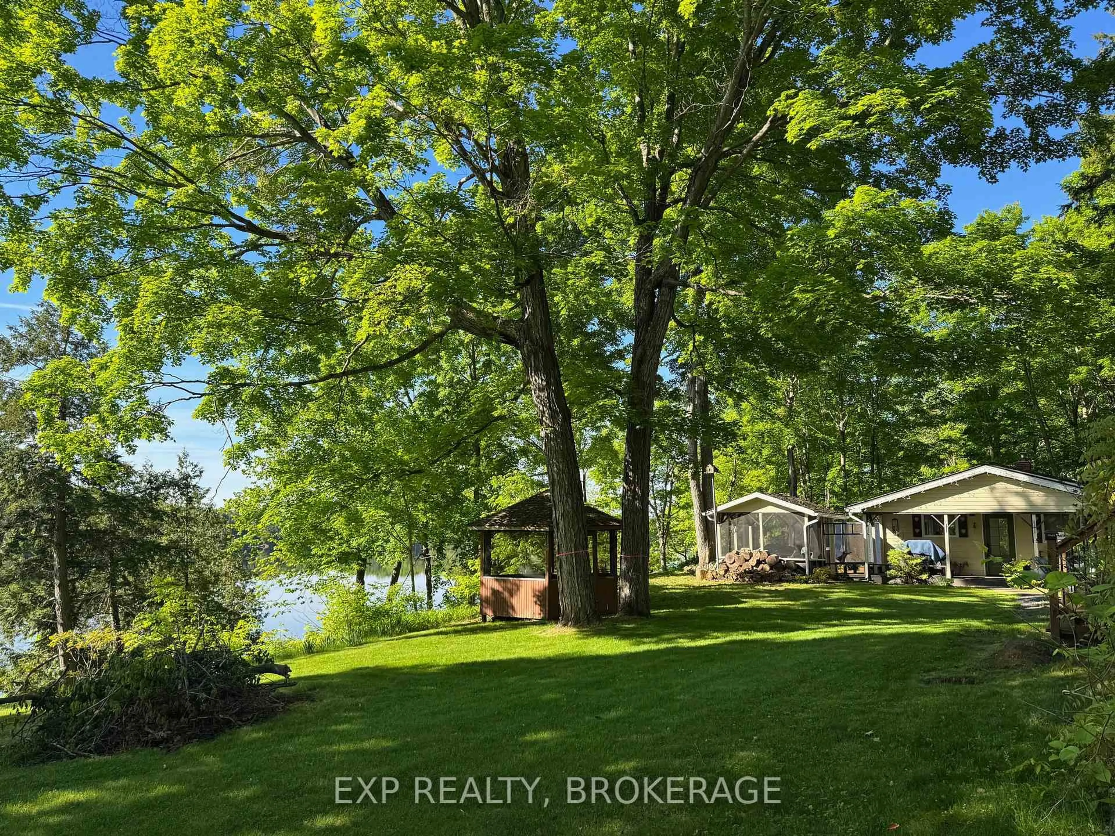 A pic from outside/outdoor area/front of a property/back of a property/a pic from drone, water/lake/river/ocean view for 2107 Hambly Lane, Hartington Ontario K0H 1W0