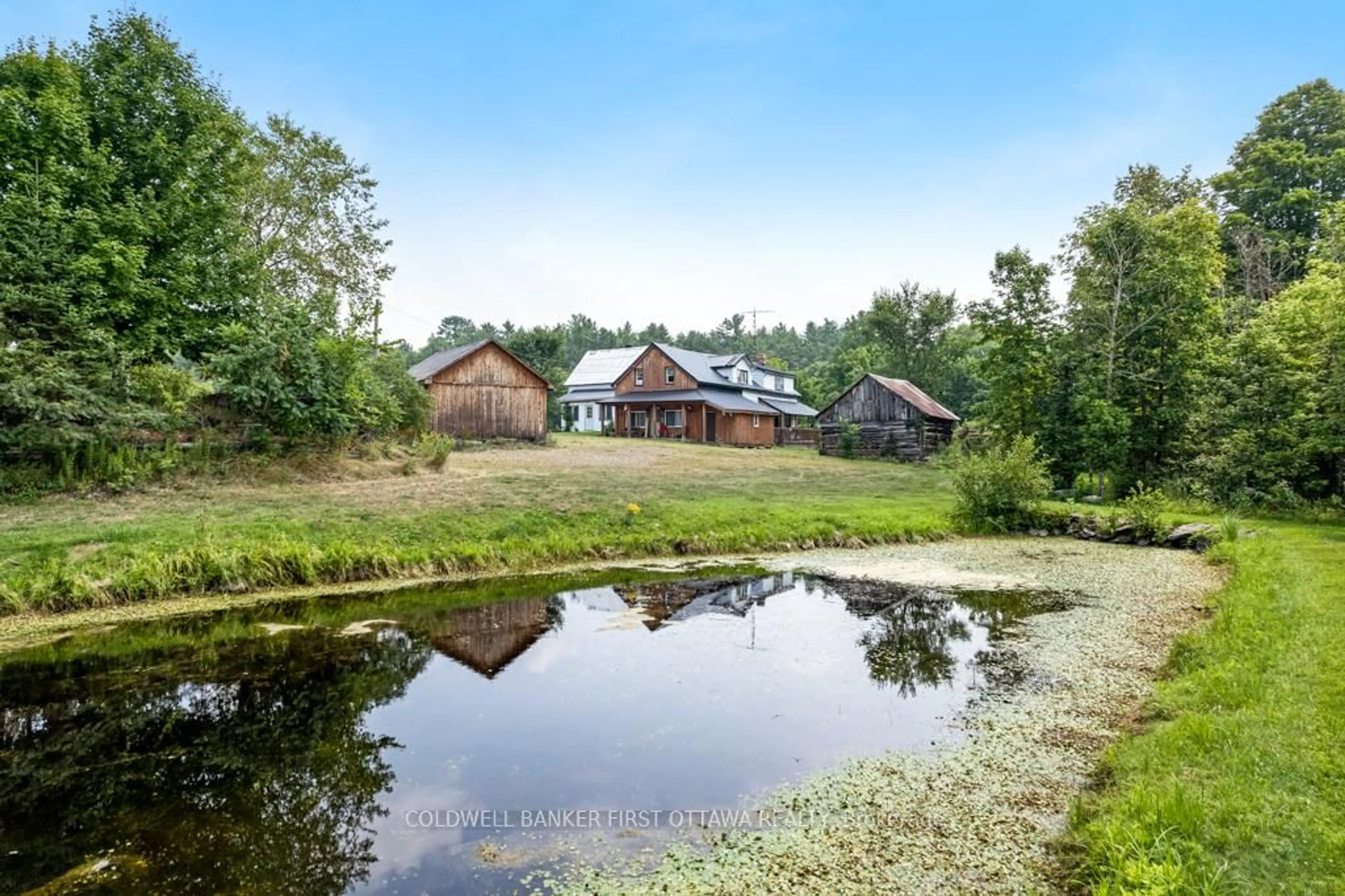 A pic from outside/outdoor area/front of a property/back of a property/a pic from drone, water/lake/river/ocean view for 1373 Flower Station Rd, Lanark Ontario K0G 1K0