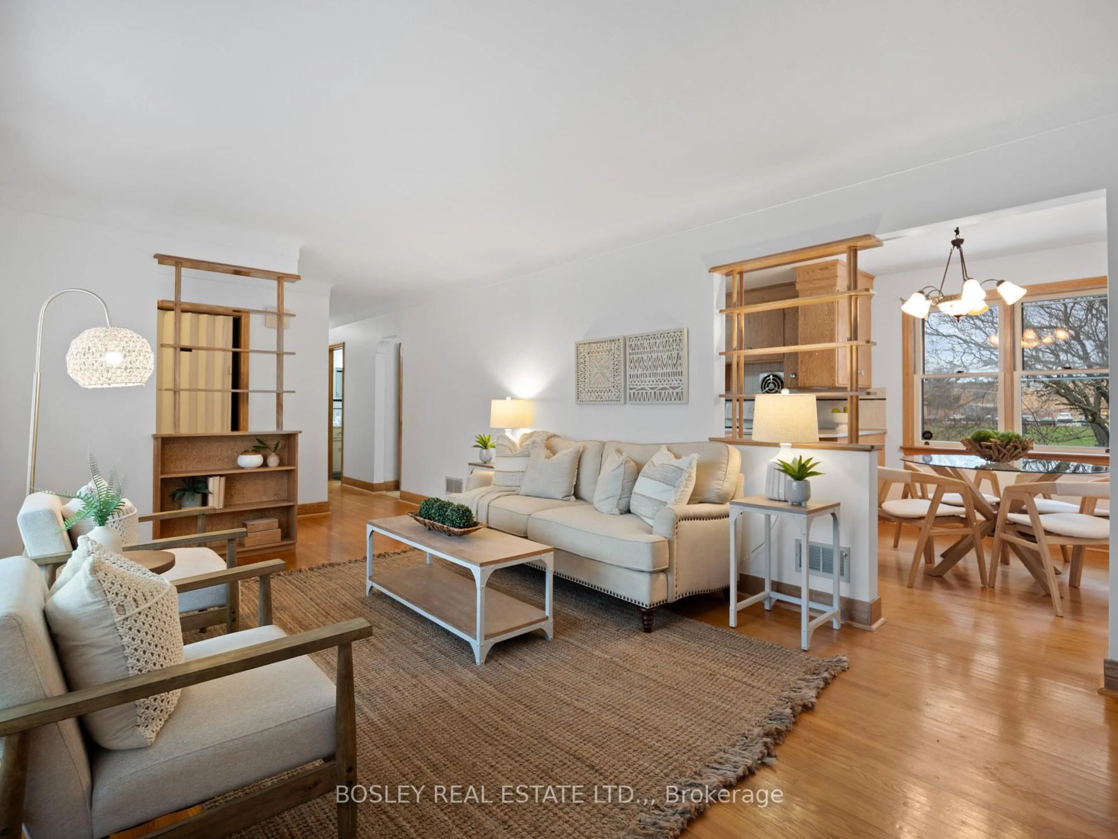 Living room with furniture, wood/laminate floor for 33 Tamarack Ave, St. Catharines Ontario L3M 3C1