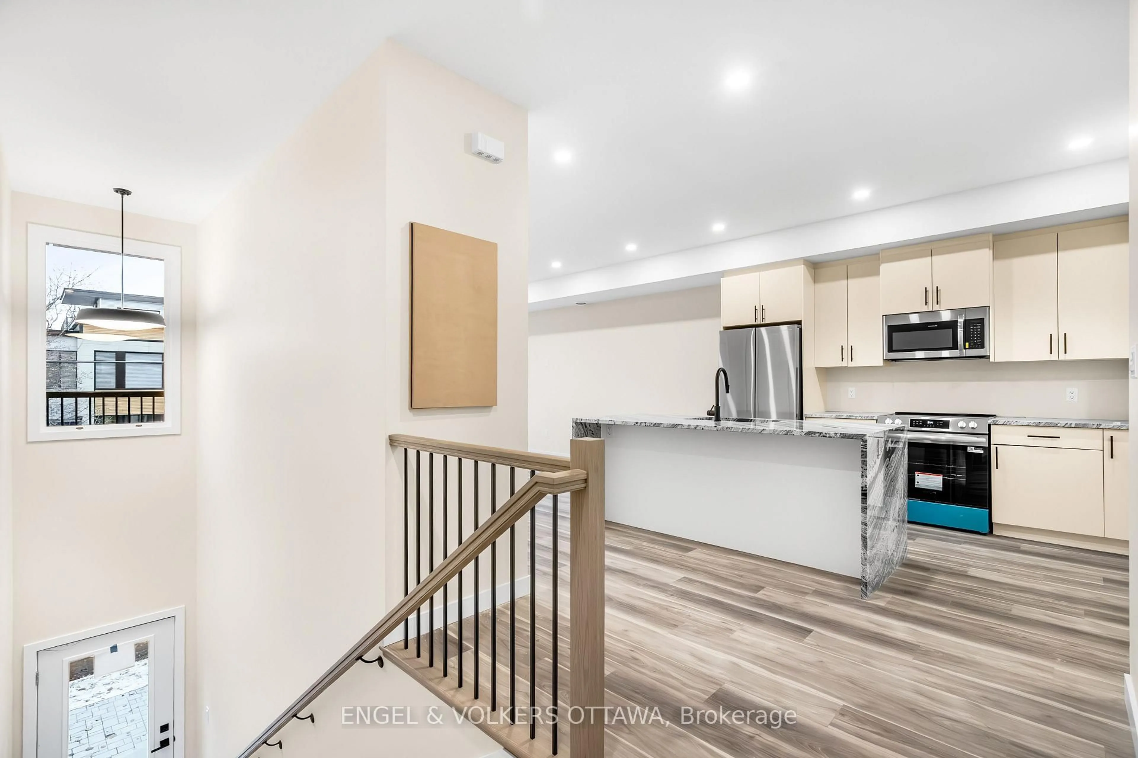 Open concept kitchen, wood/laminate floor for 193 Hopewell Ave, Ottawa Ontario K1S 2Z4