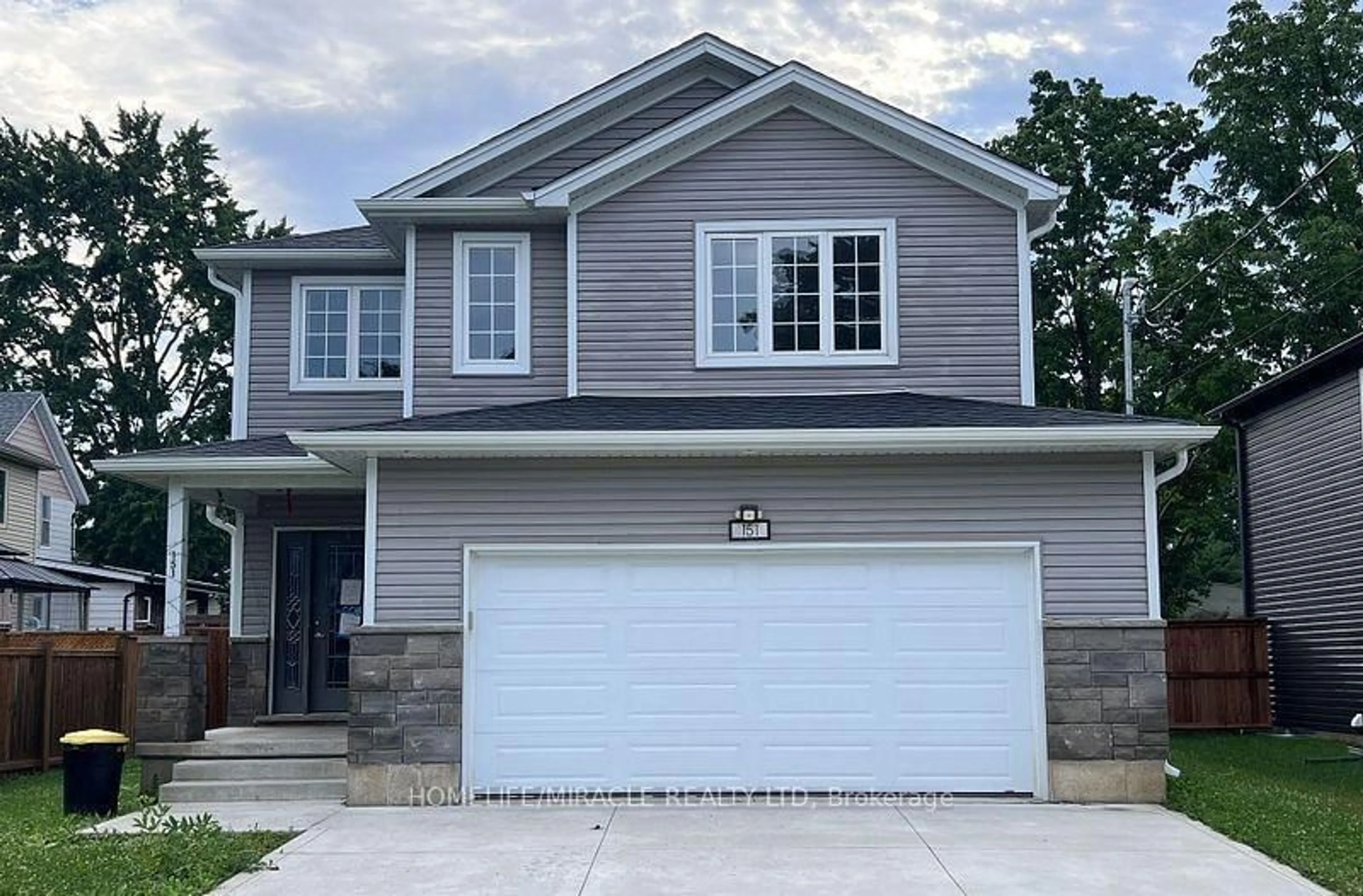 Home with vinyl exterior material, street for 151 Agnes St, Thames Centre Ontario N0M 2P0