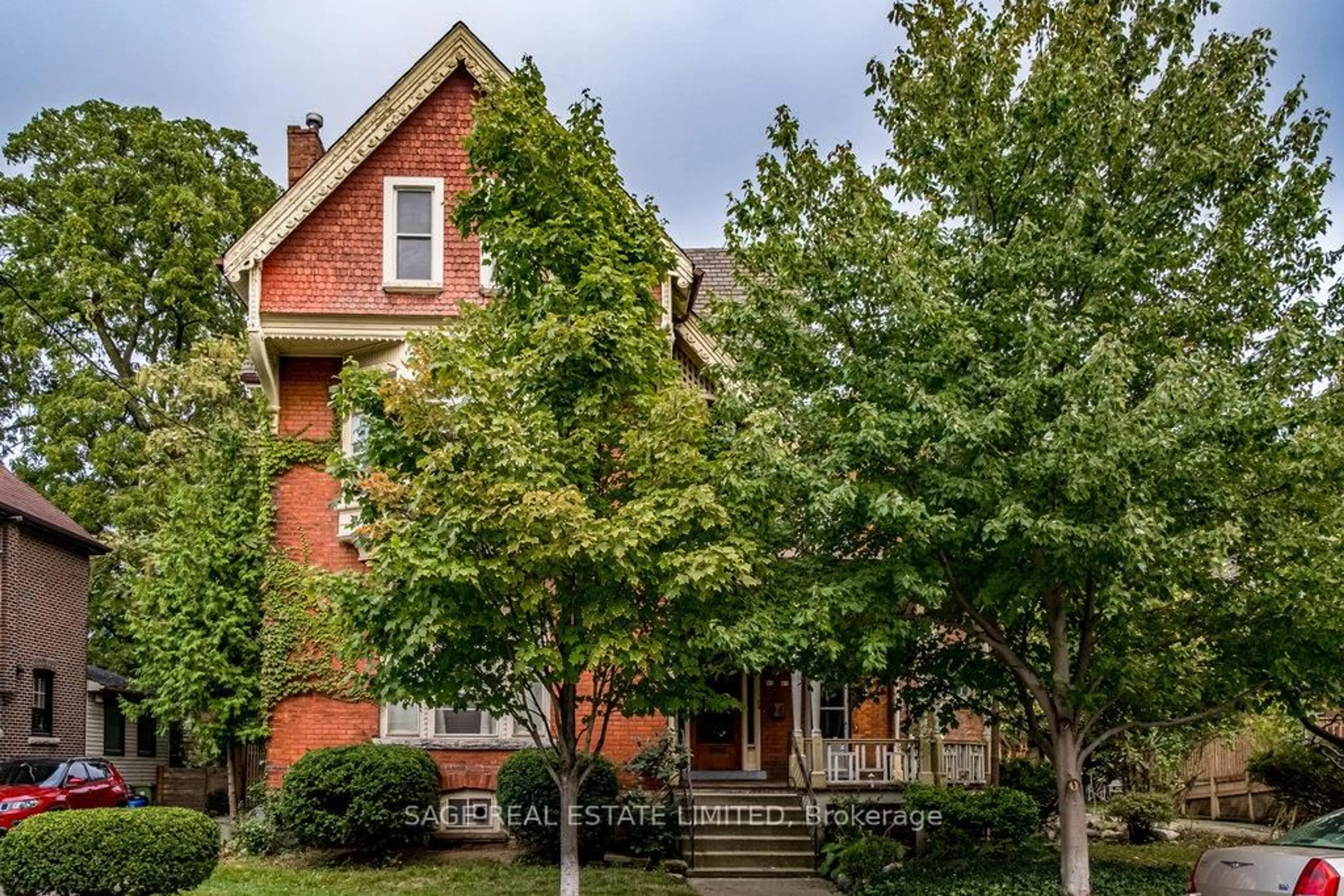 Home with brick exterior material, street for 95-97 FAIRHOLT Rd, Hamilton Ontario L8M 2T6