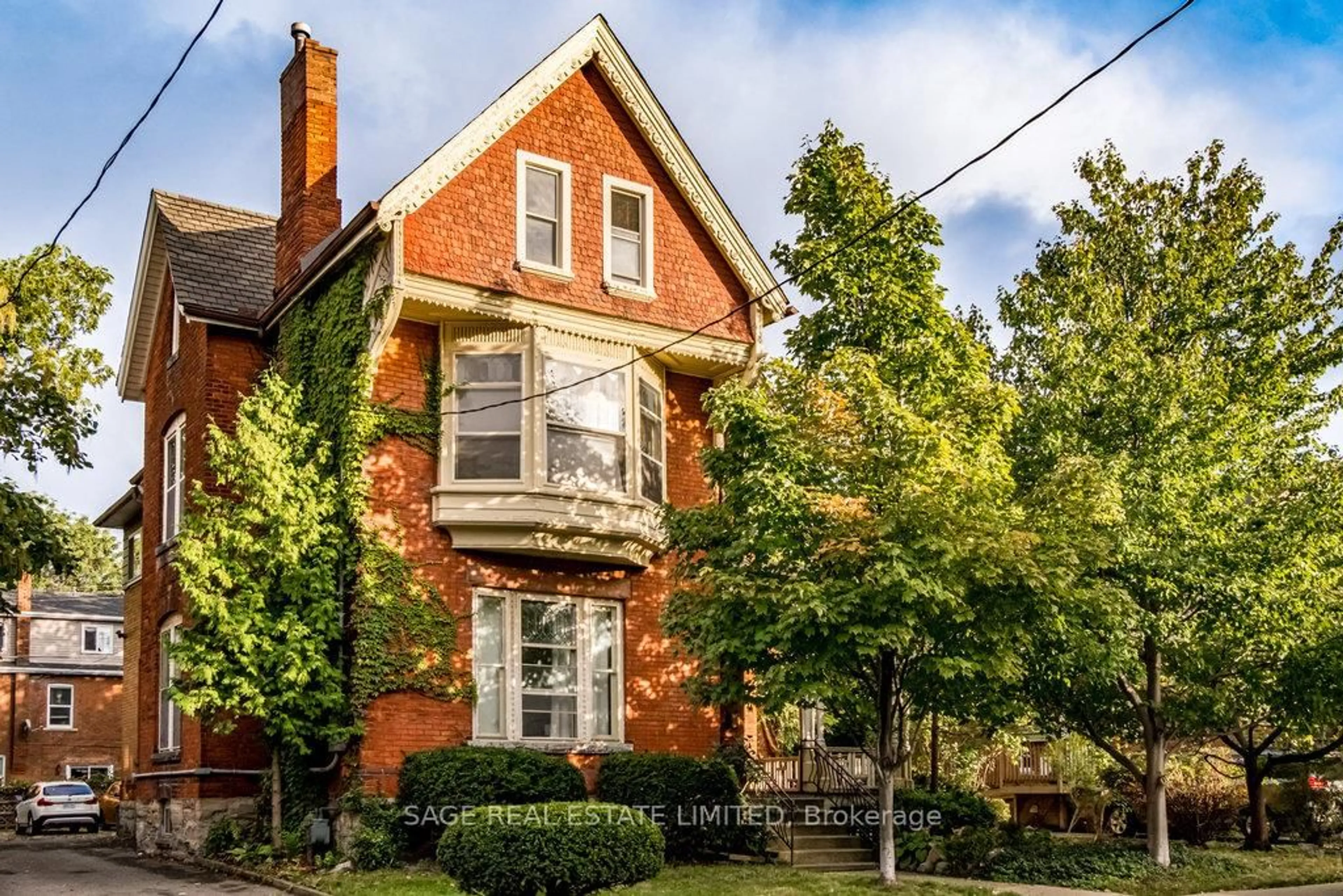 Home with brick exterior material, street for 95-97 FAIRHOLT Rd, Hamilton Ontario L8M 2T6