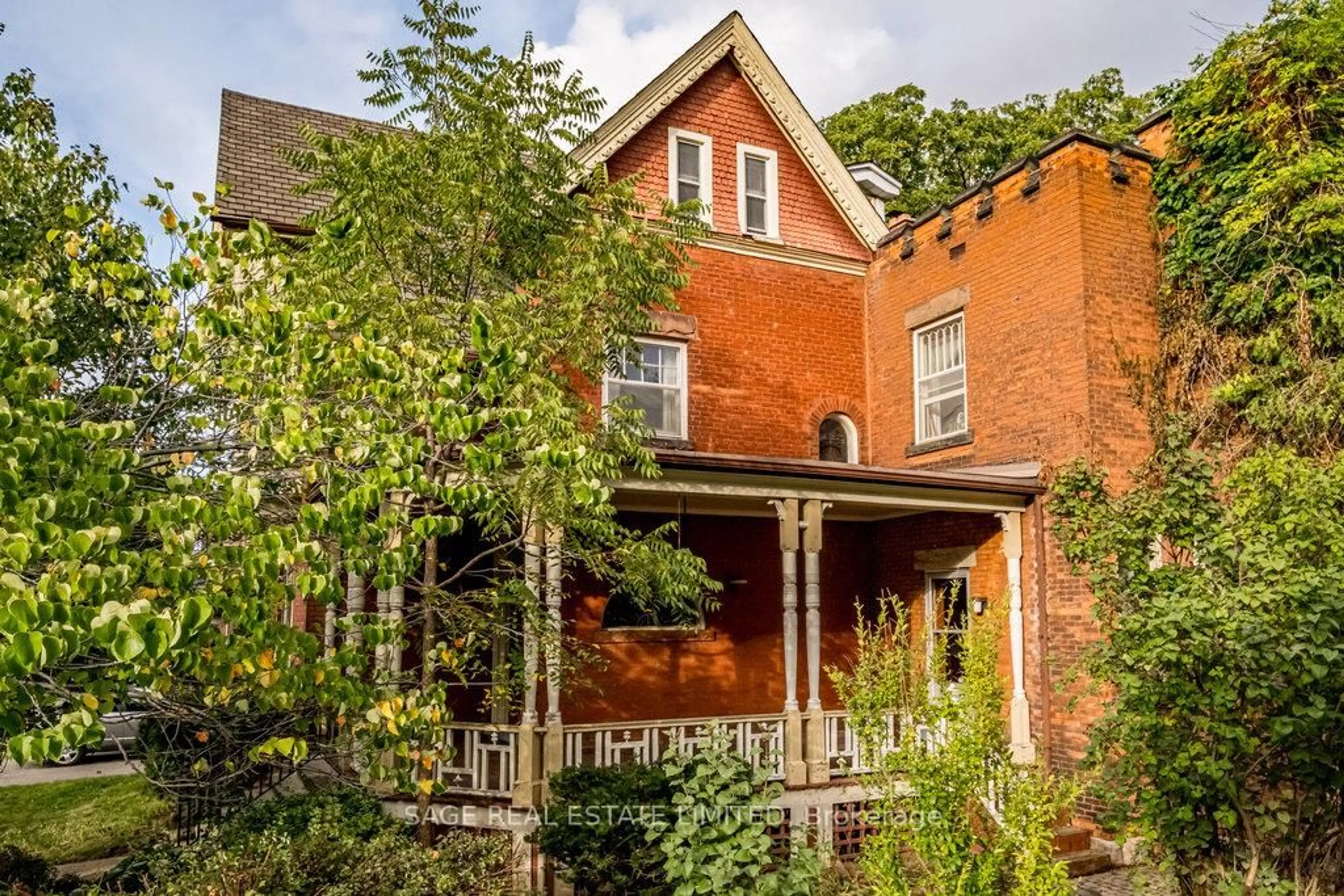 Home with brick exterior material, street for 95-97 FAIRHOLT Rd, Hamilton Ontario L8M 2T6