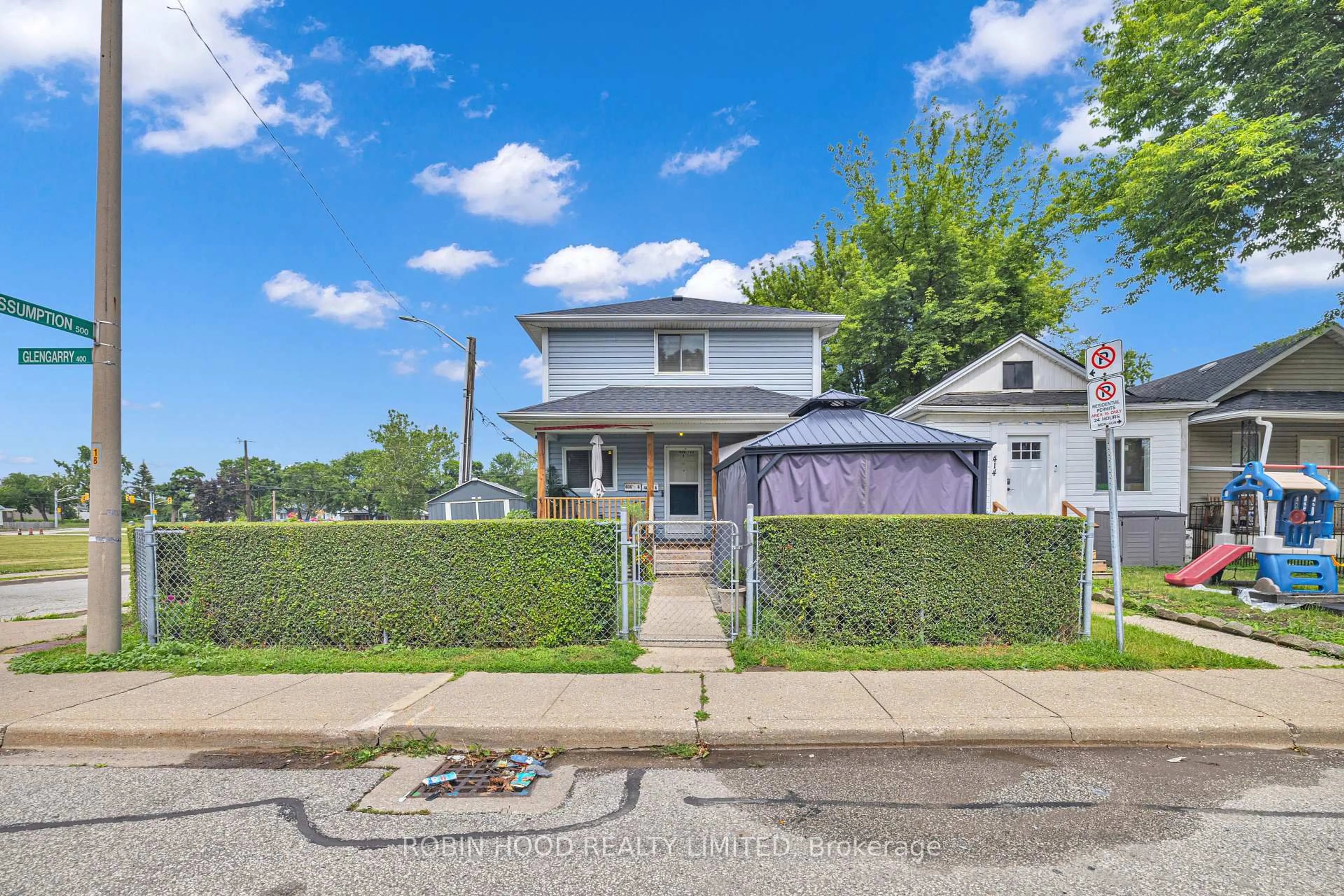 A pic from outside/outdoor area/front of a property/back of a property/a pic from drone, street for 406 Glengarry Ave, Windsor Ontario N9A 1P9