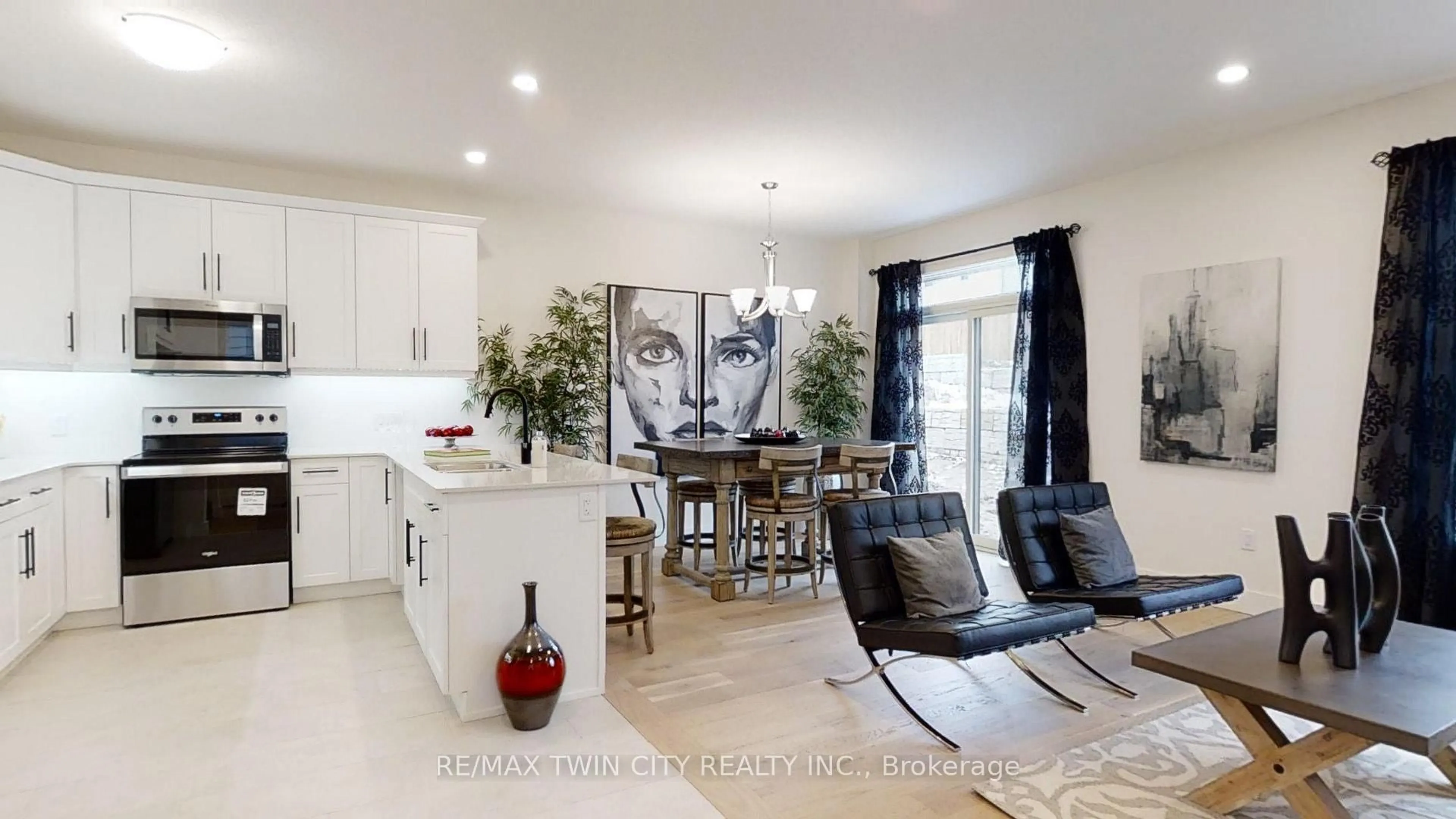 Open concept kitchen, wood/laminate floor for 941 DEVERON Cres, London South Ontario N5X 3X4