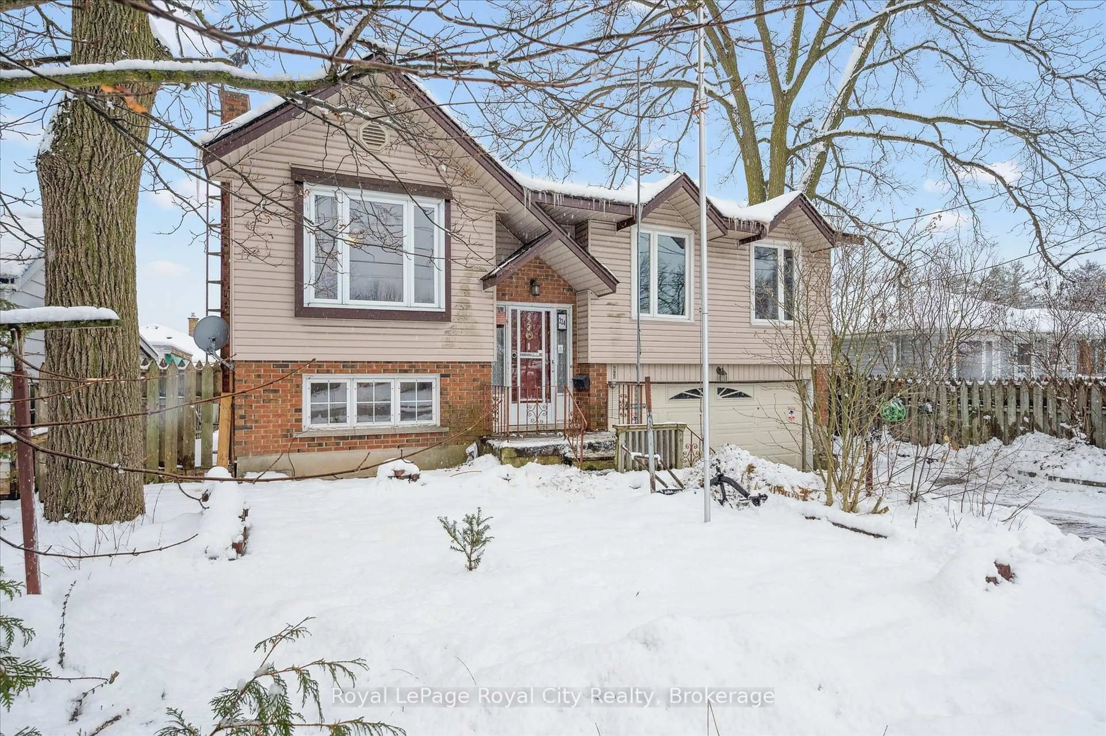 Home with vinyl exterior material, street for 224 DELHI St, Guelph Ontario N1E 4K2