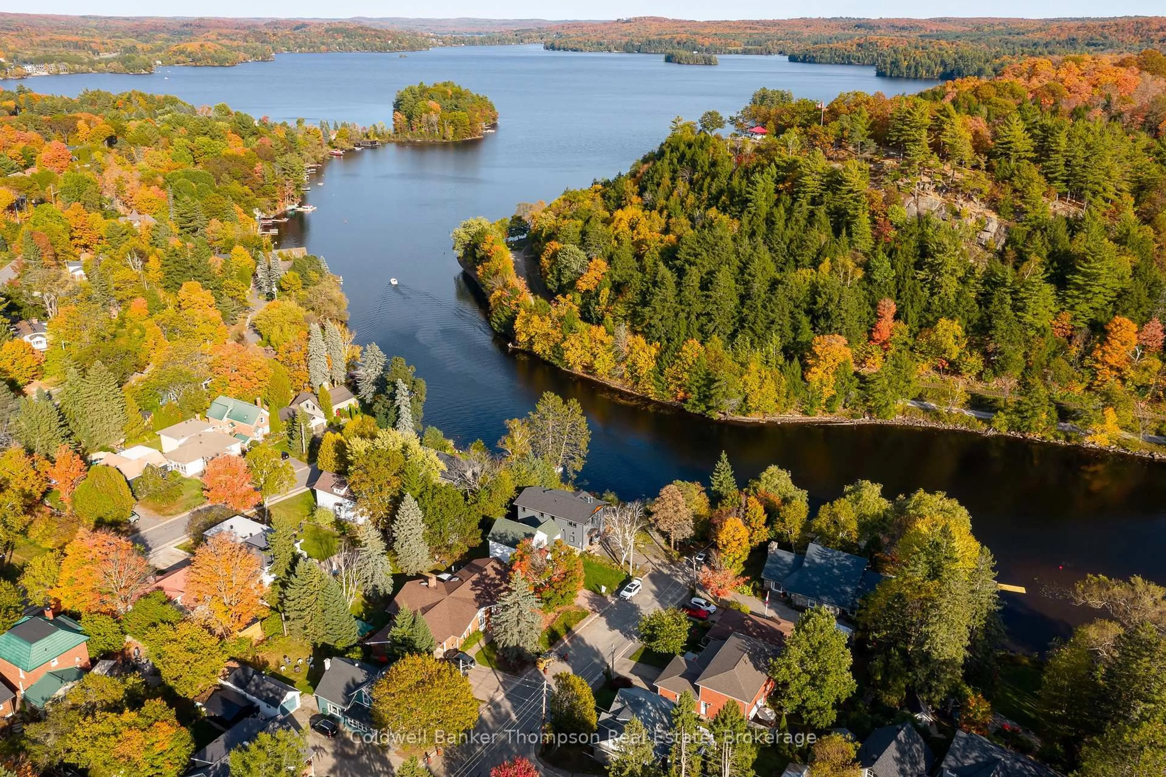 A pic from outside/outdoor area/front of a property/back of a property/a pic from drone, water/lake/river/ocean view for 32 Church St, Huntsville Ontario P1H 1G8