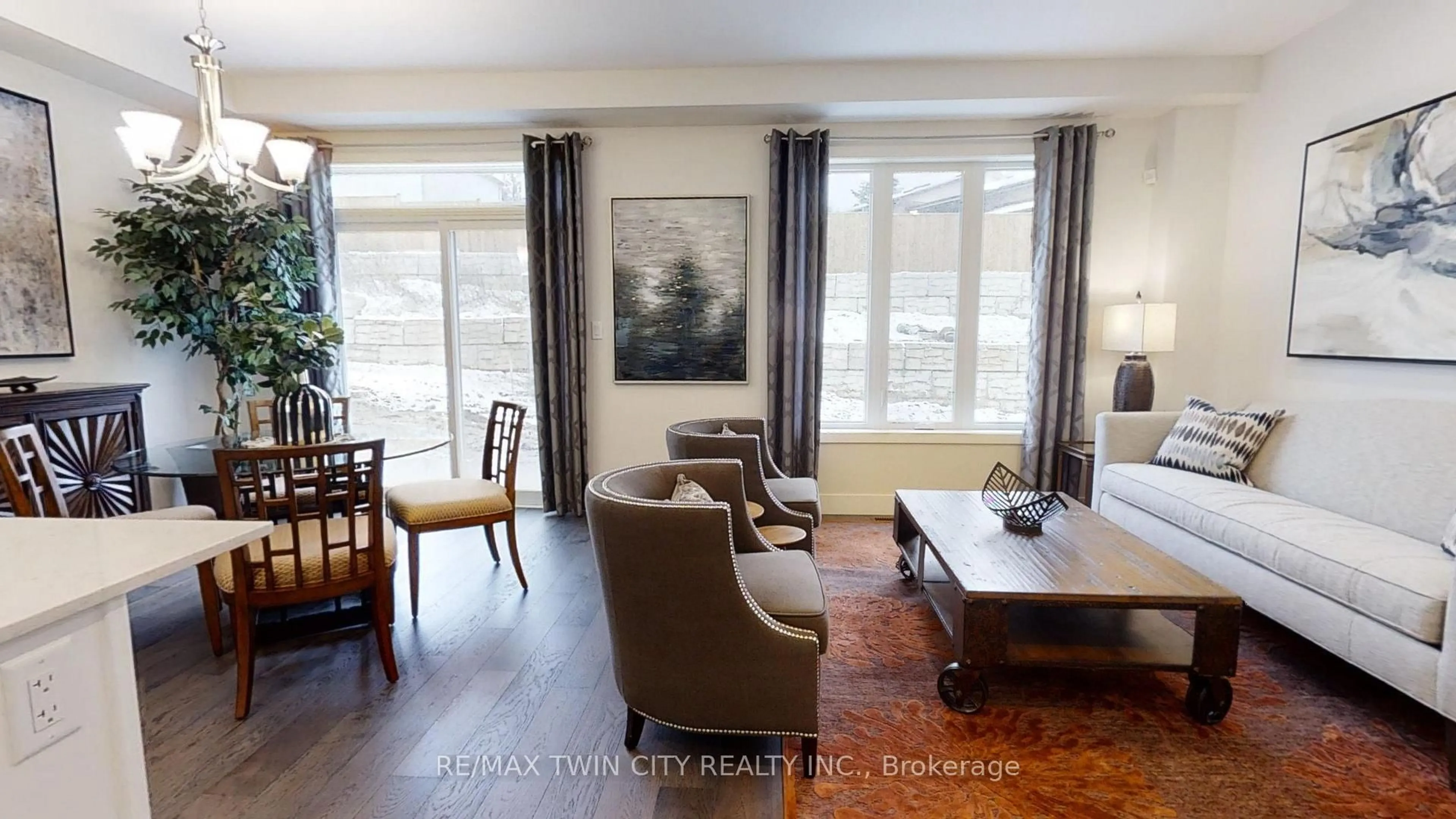Living room with furniture, wood/laminate floor for 73 JULIE Cres, London South Ontario N5X 3X4