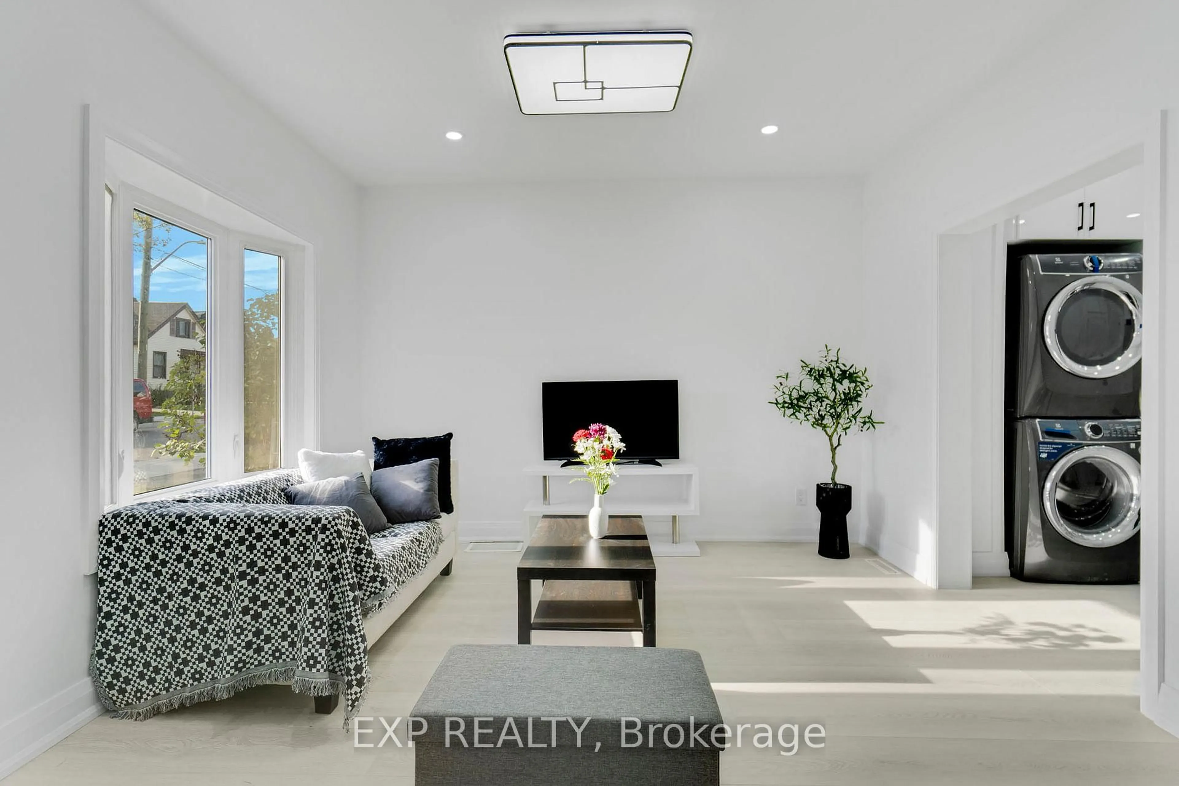 Living room with furniture, ceramic/tile floor for 217 Fairfield Ave, Hamilton Ontario L8H 5H5