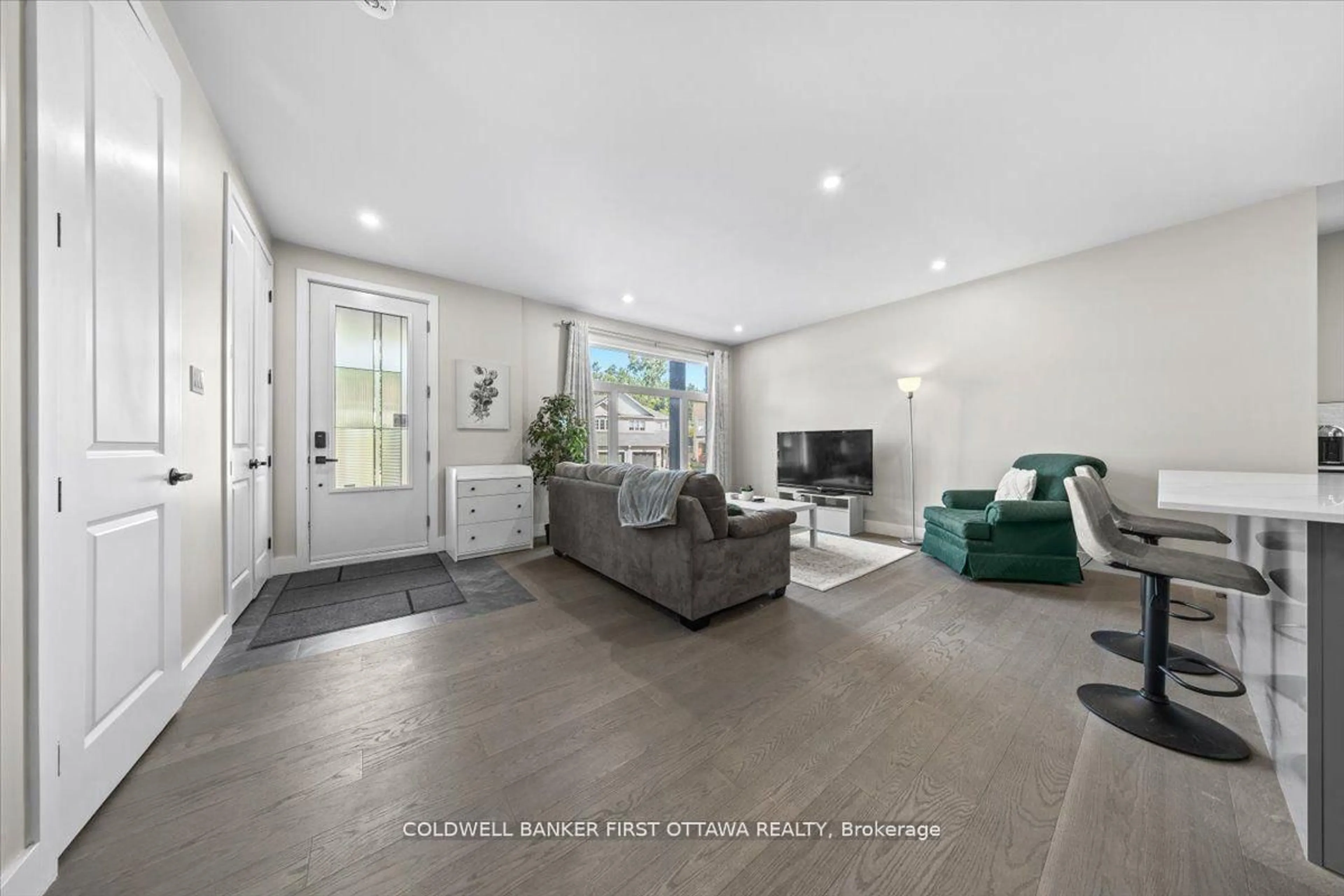 Living room with furniture, ceramic/tile floor for 25 Pennard Way #A & B, Ottawa Ontario K1T 4C1